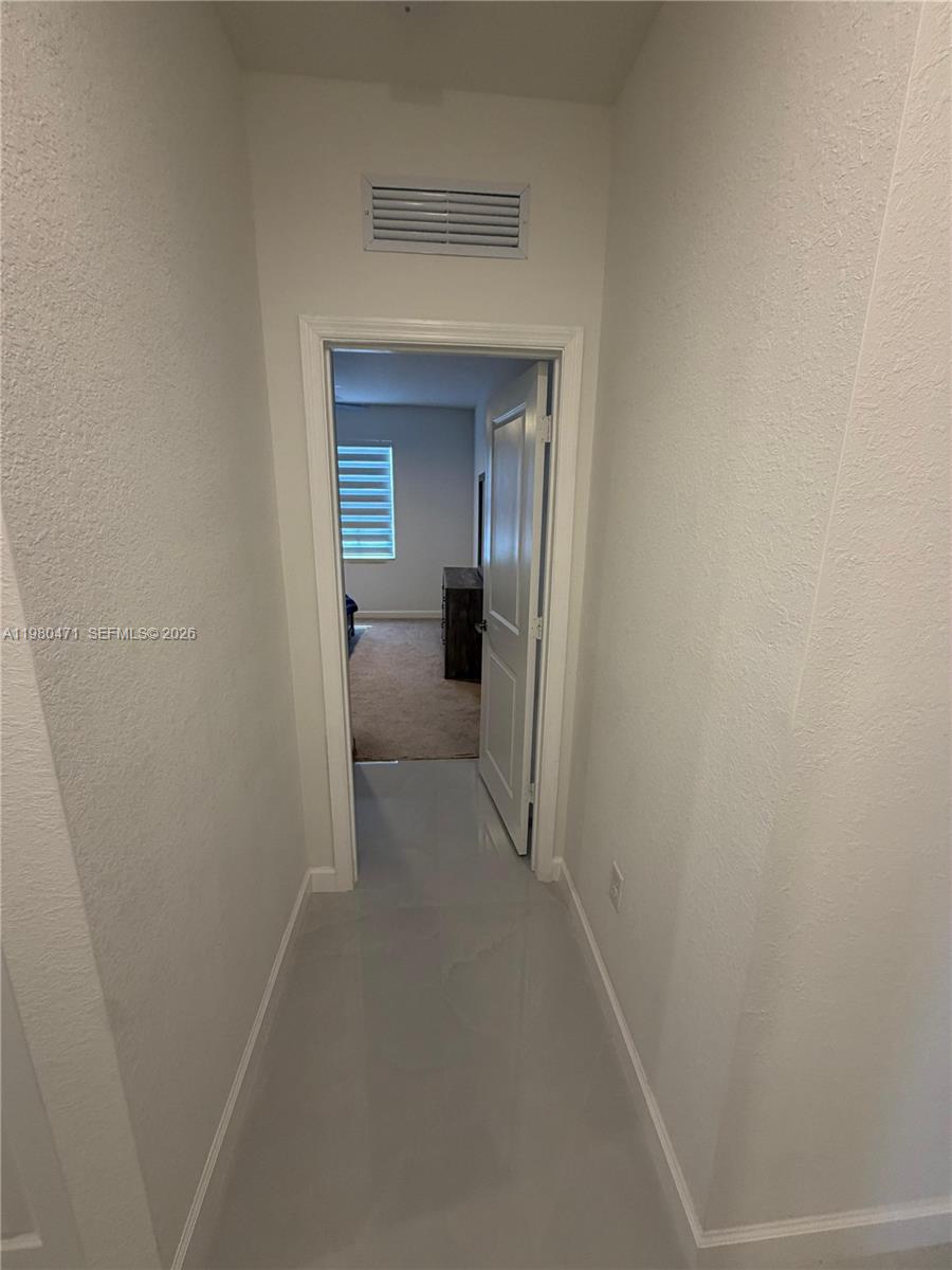 16751 Southwest 291st Terrace, Unit 16751 Homestead, FL 33030 - Photo 7 of 20 a view of a room with a wardrobe space