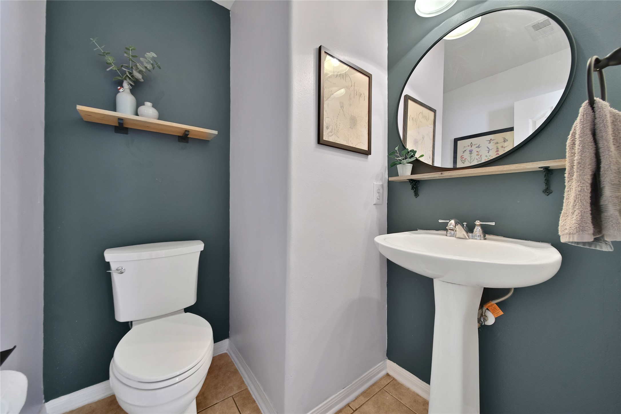 21715 Flecherwood Court Spring, TX 77388 - Photo 13 of 43 a bathroom with a toilet a sink and a mirror
