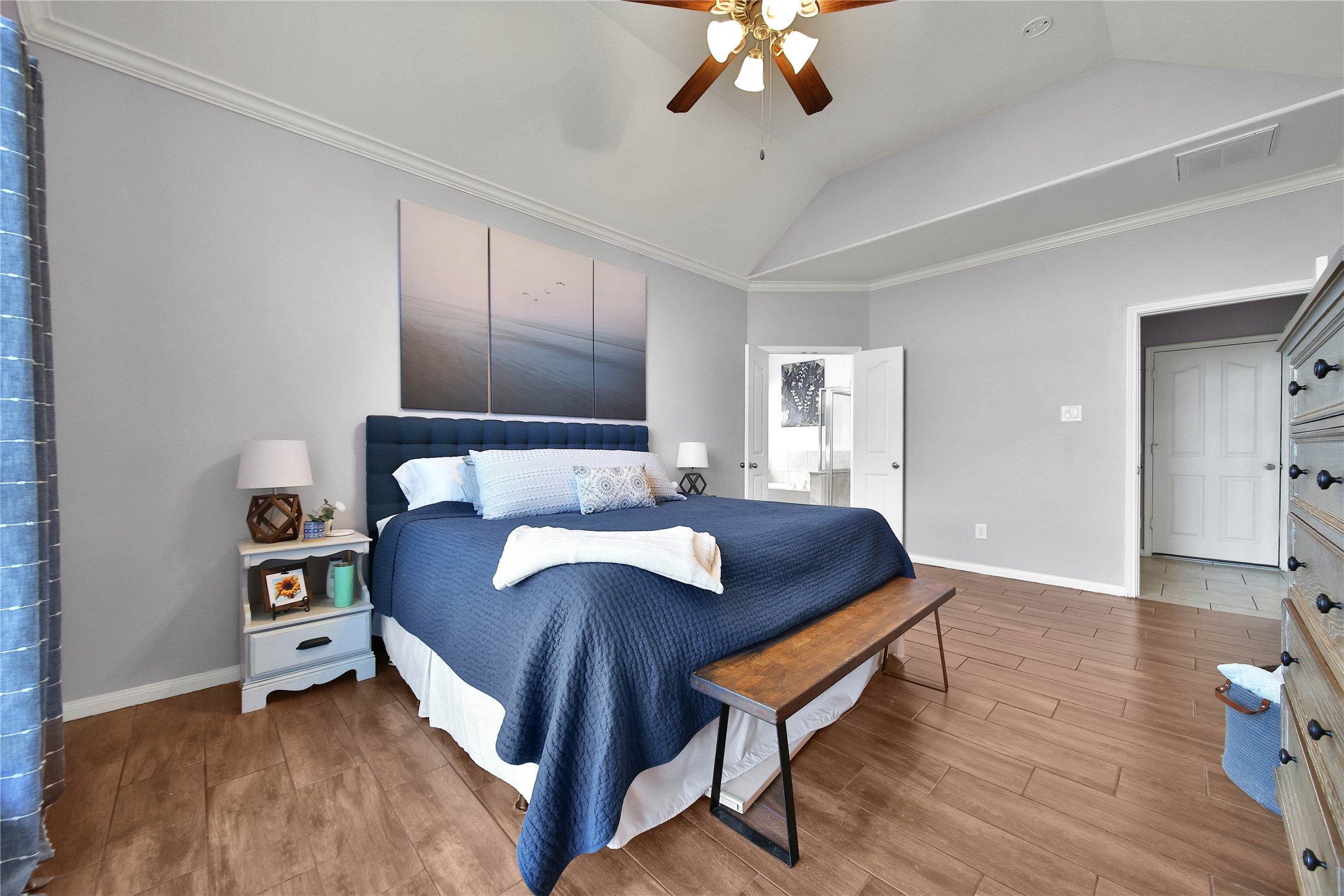 21715 Flecherwood Court Spring, TX 77388 - Photo 19 of 43 a bedroom with a bed and a chandelier