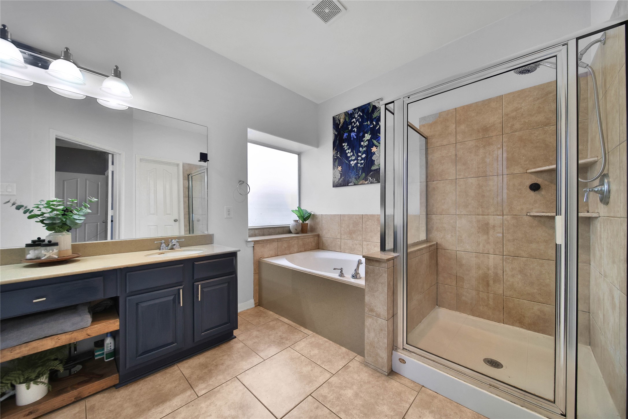 21715 Flecherwood Court Spring, TX 77388 - Photo 21 of 43 a bathroom with a tub sink and mirror