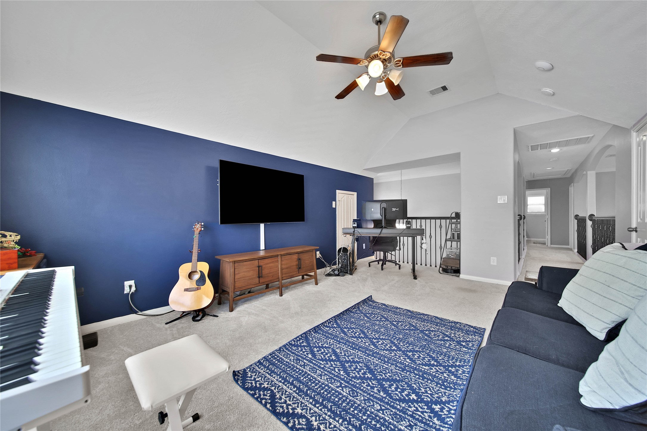 21715 Flecherwood Court Spring, TX 77388 - Photo 25 of 43 a living room with furniture and a flat screen tv