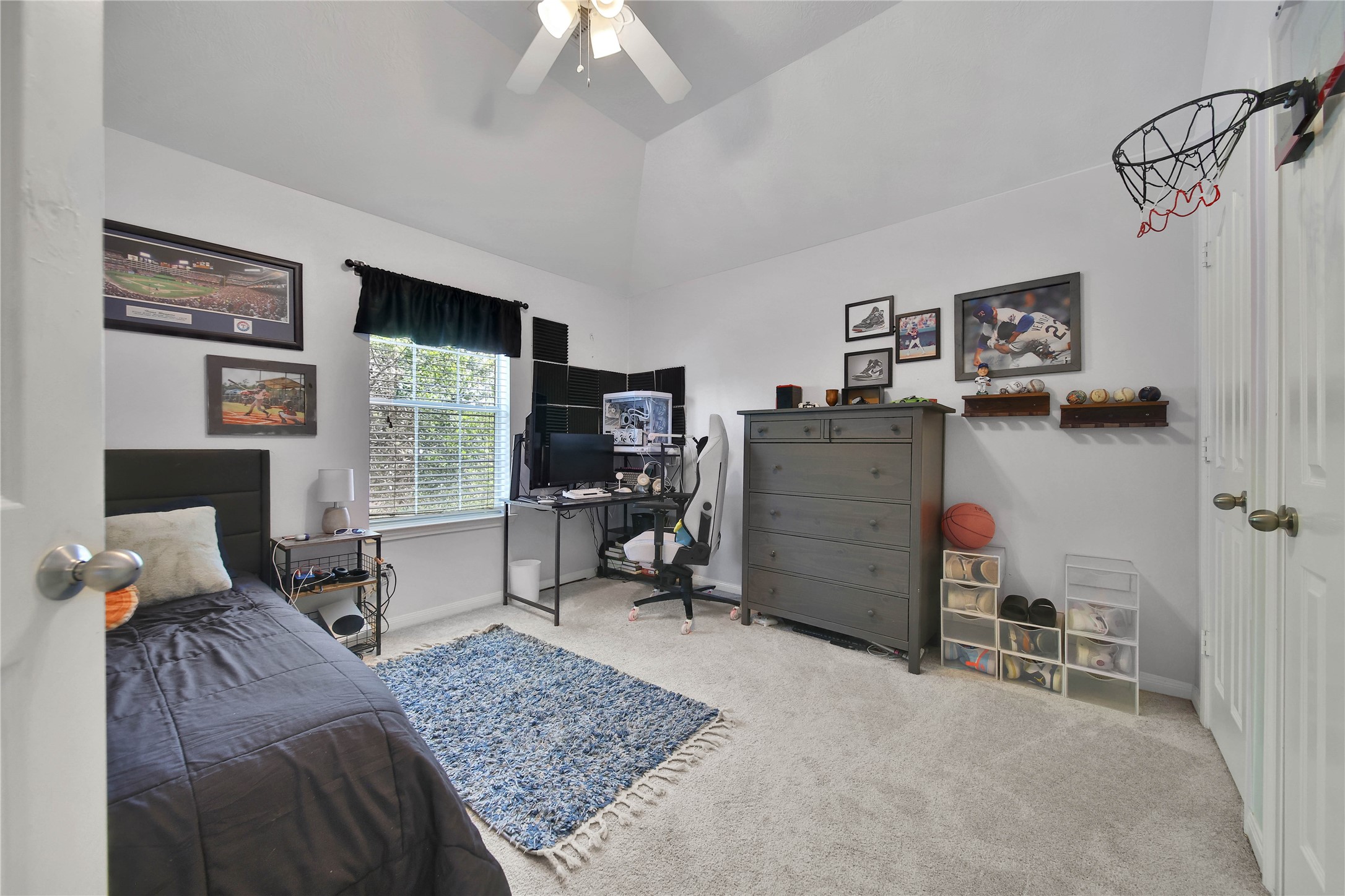 21715 Flecherwood Court Spring, TX 77388 - Photo 27 of 43 a bedroom with furniture and a flat screen tv