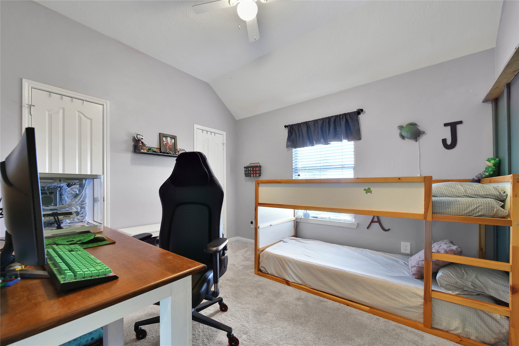 21715 Flecherwood Court Spring, TX 77388 - Photo 29 of 43 a living room with furniture and a flat screen tv