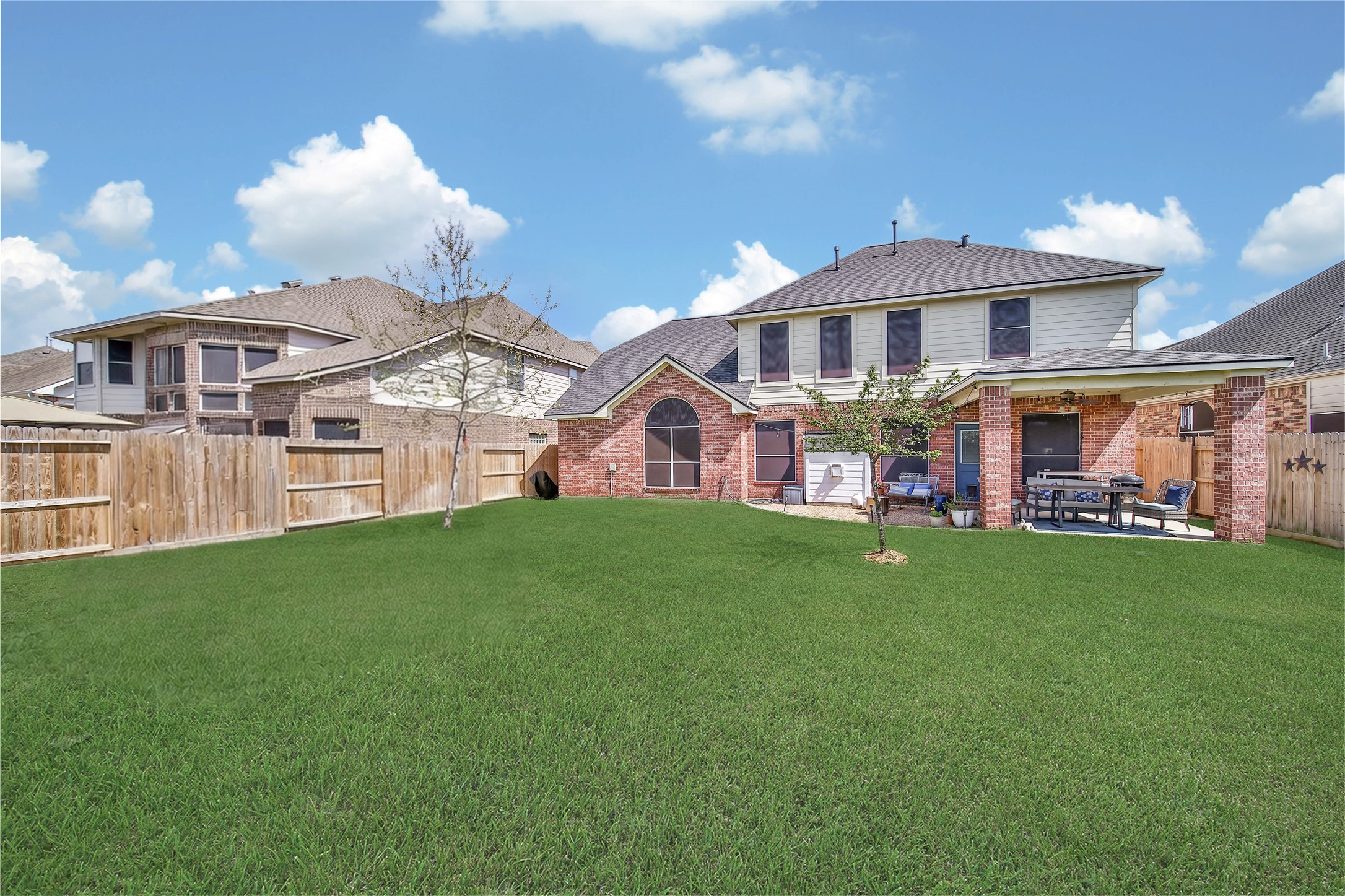 21715 Flecherwood Court Spring, TX 77388 - Photo 34 of 43 a view of a big house with a big yard and large trees