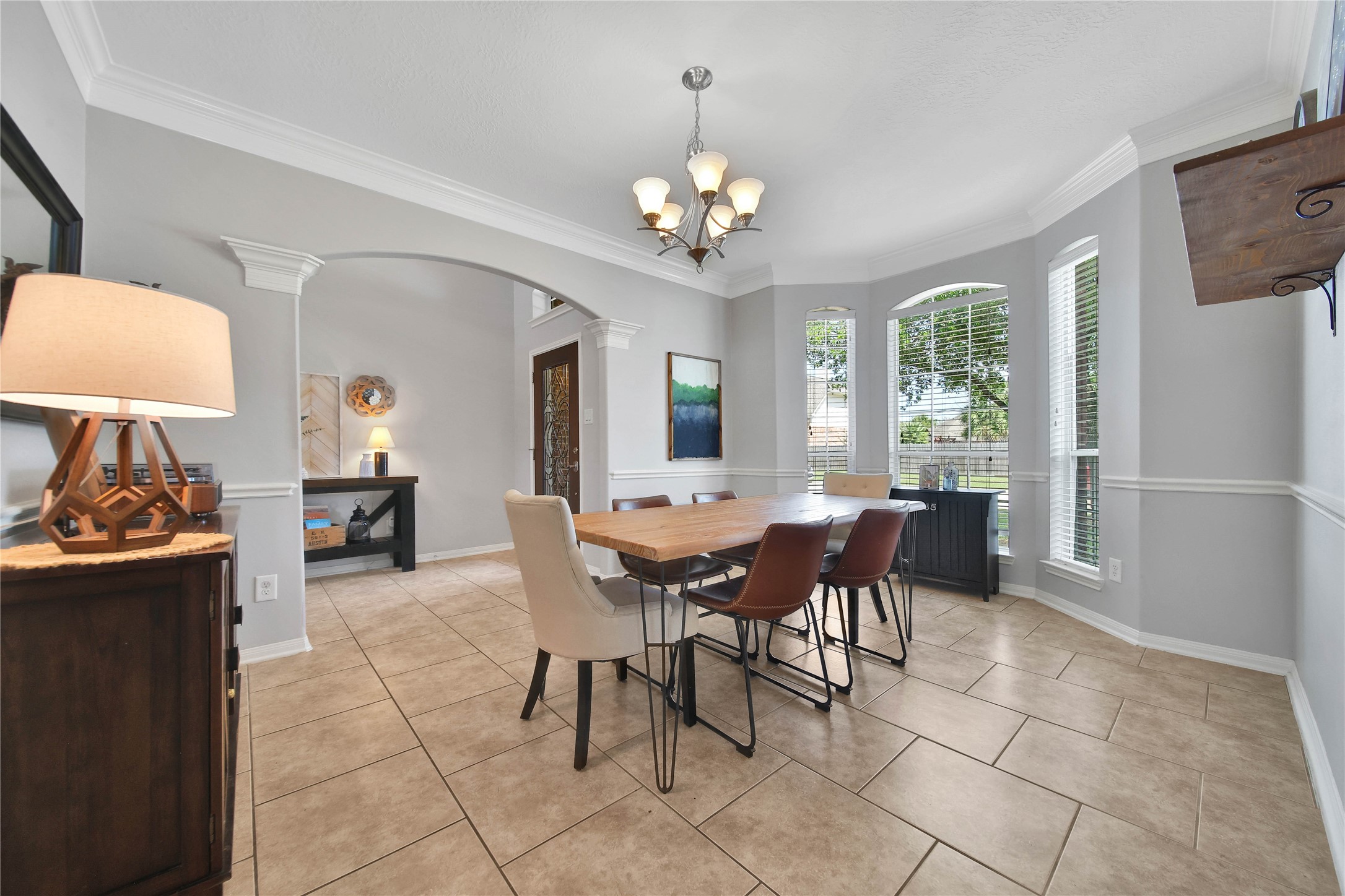 21715 Flecherwood Court Spring, TX 77388 - Photo 9 of 43 a view of a dining room with furniture and a chandelier