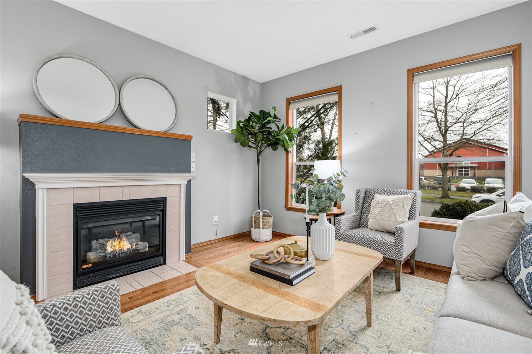34741 Southeast Ridge Street Snoqualmie, WA 98065 - Photo 8 of 30 a living room with furniture a window and a fireplace