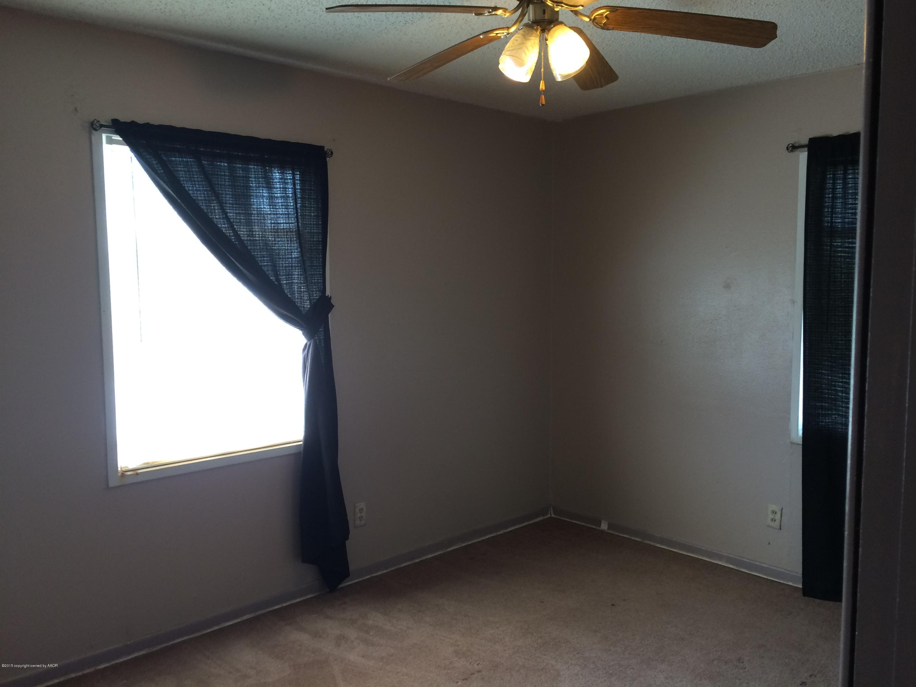 4635 South Hayden Street Amarillo, TX 79110 - Photo 8 of 10 an empty room with window