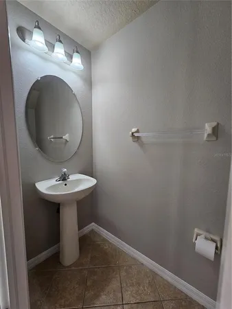 a bathroom with a sink and mirror