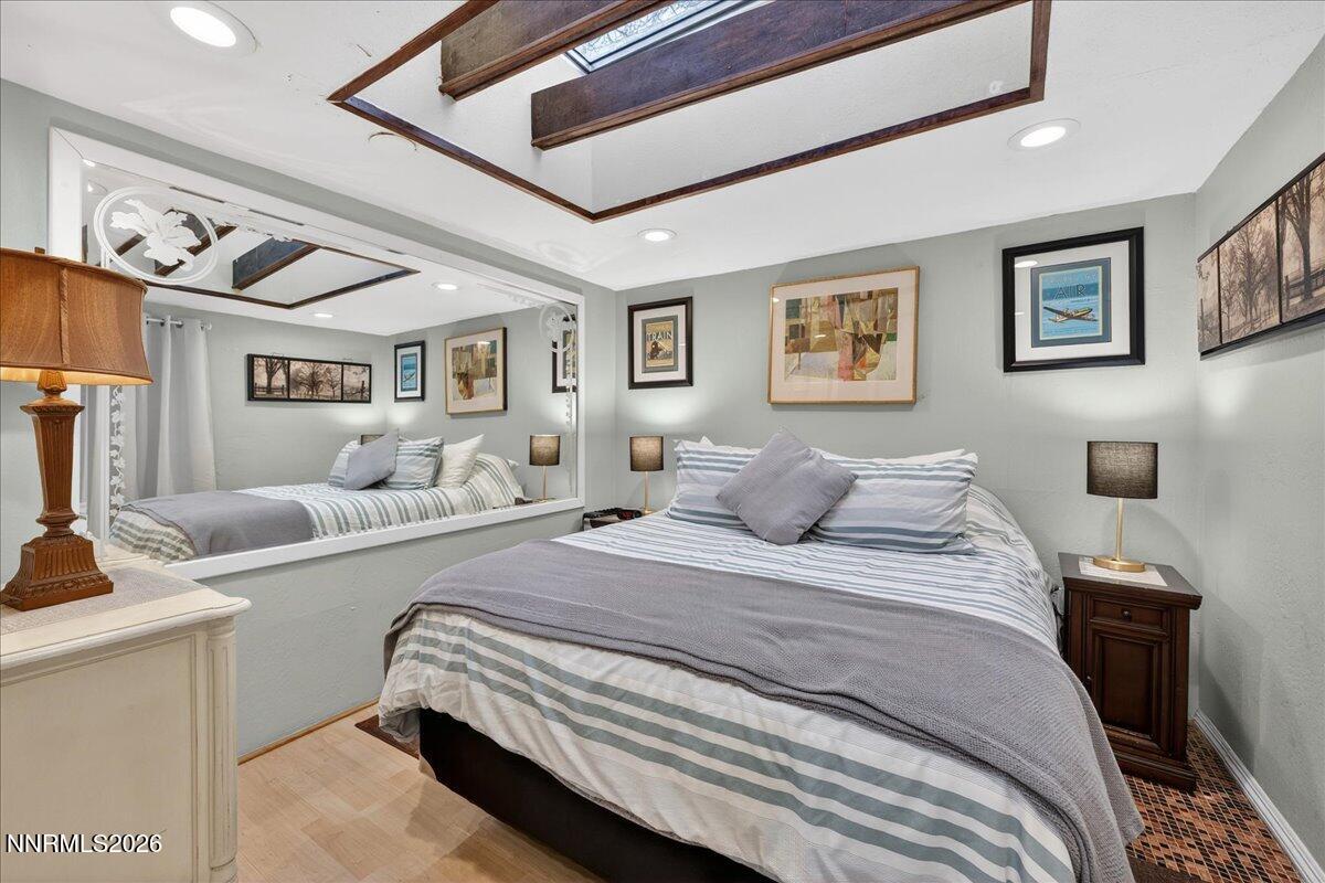 611 Nixon Avenue Reno, NV 89509 - Photo 19 of 43 a bedroom with a large bed and a couch