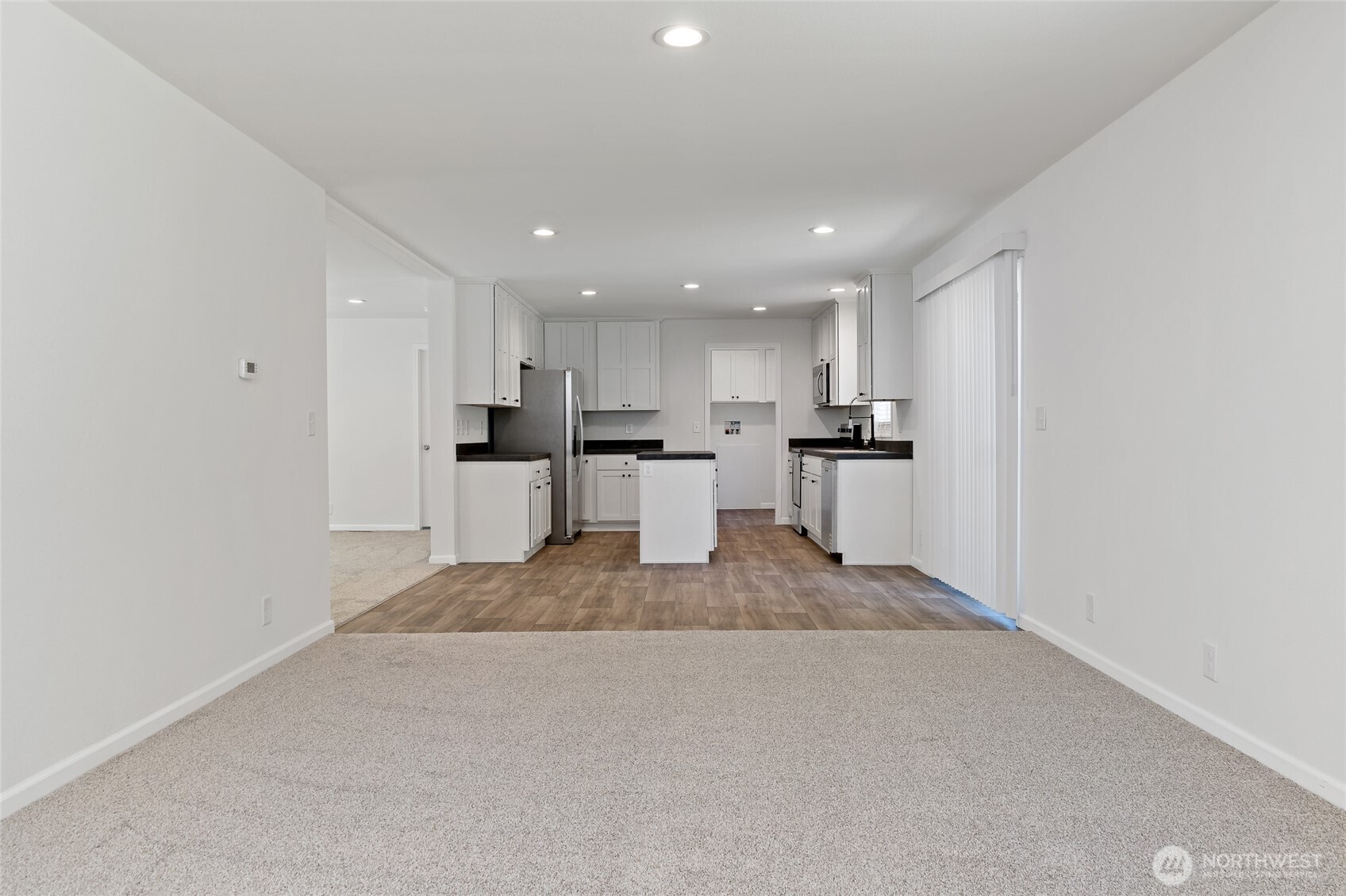 17217 80th Street Southwest Longbranch, WA 98351 - Photo 16 of 39 a kitchen with stainless steel appliances granite countertop a refrigerator and a sink