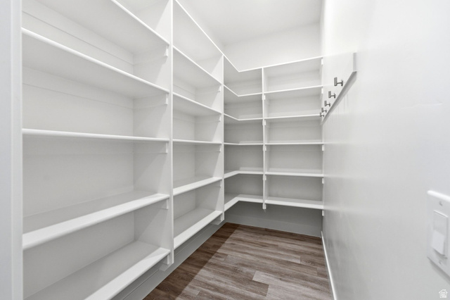 496 North Farmhouse Way, Unit 11 Midway, UT 84049 - Photo 20 of 50 Spacious walk-in pantry featuring white shelving, light wood-finish flooring, and wall-mounted hooks