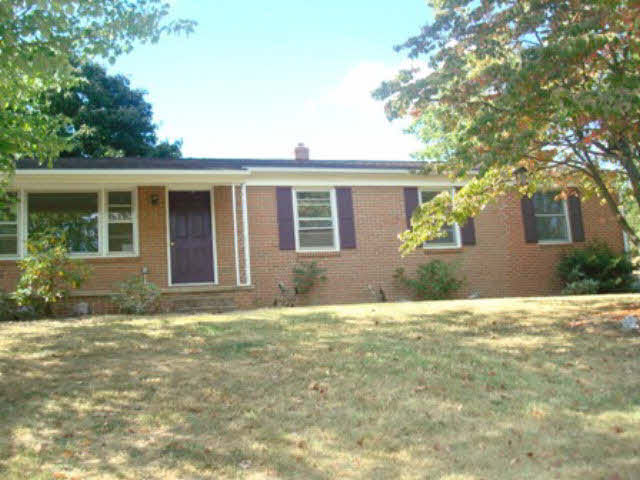 9626 Union Springs Road Dayton, VA 22821 - Photo 1 of 1 a house that has a tree in front of it
