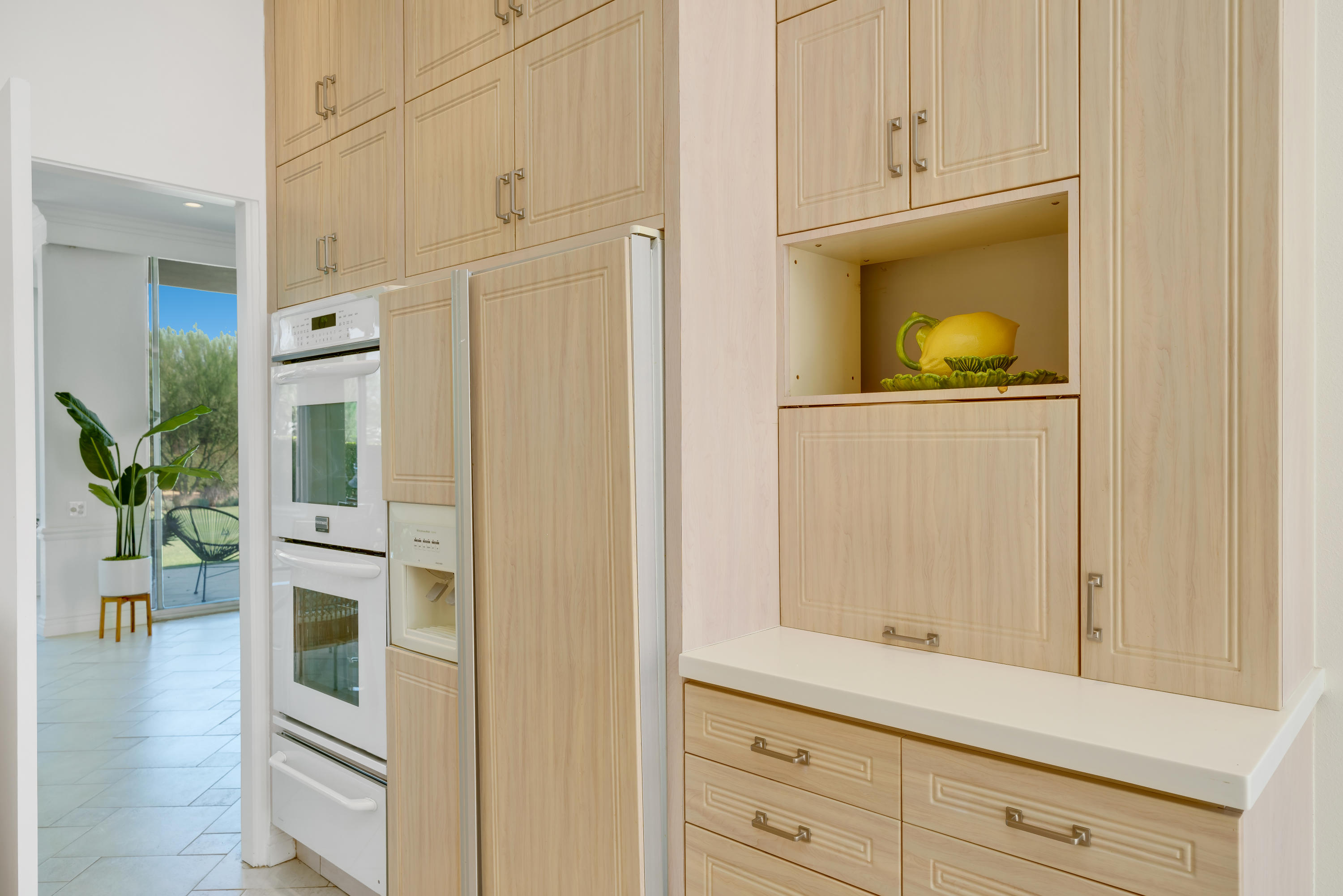 47420 Rabat Drive Palm Desert, CA 92260 - Photo 11 of 50 a view of a hallway with wooden floor and cabinet