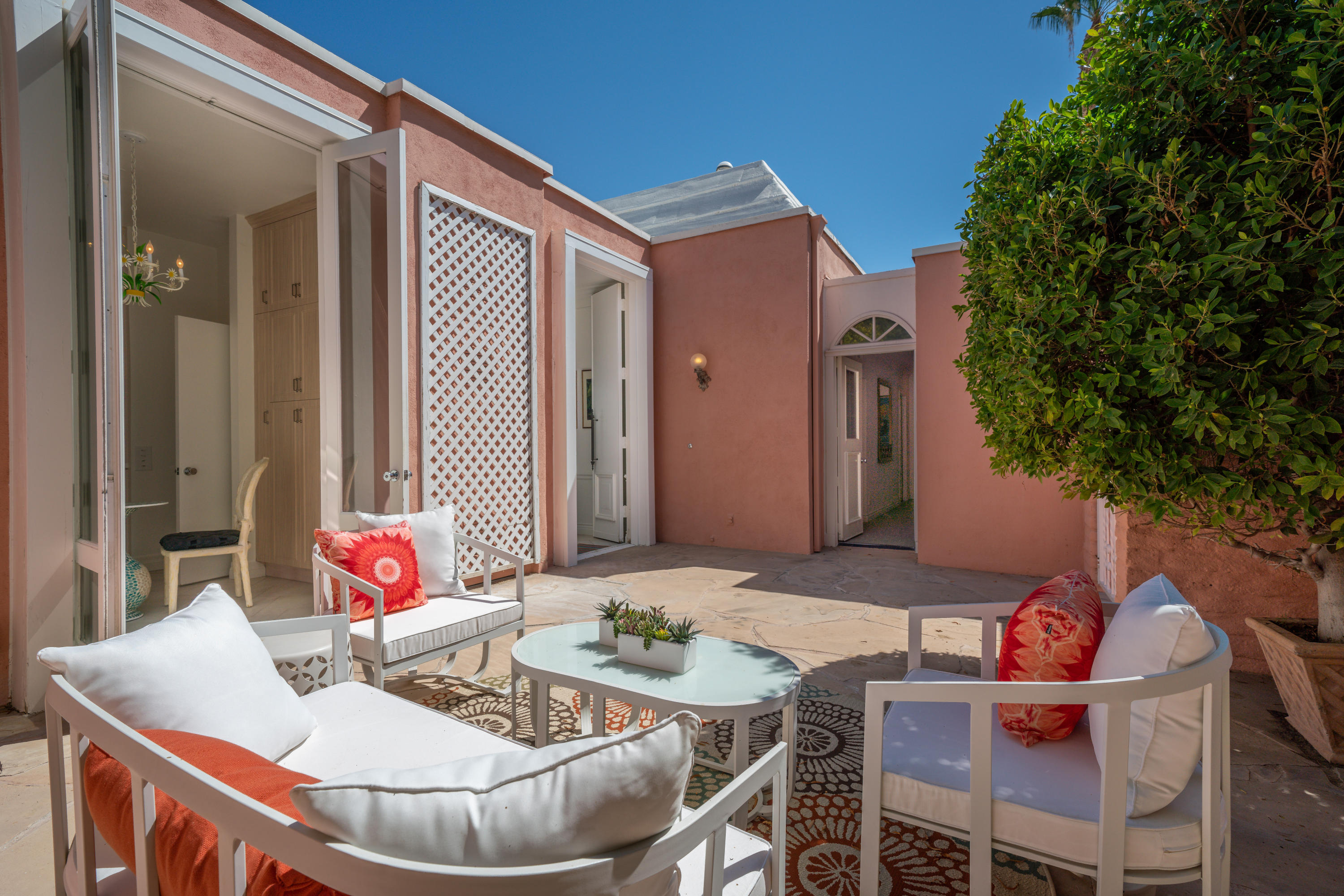 47420 Rabat Drive Palm Desert, CA 92260 - Photo 17 of 50 a patio with a table and chairs and potted plants
