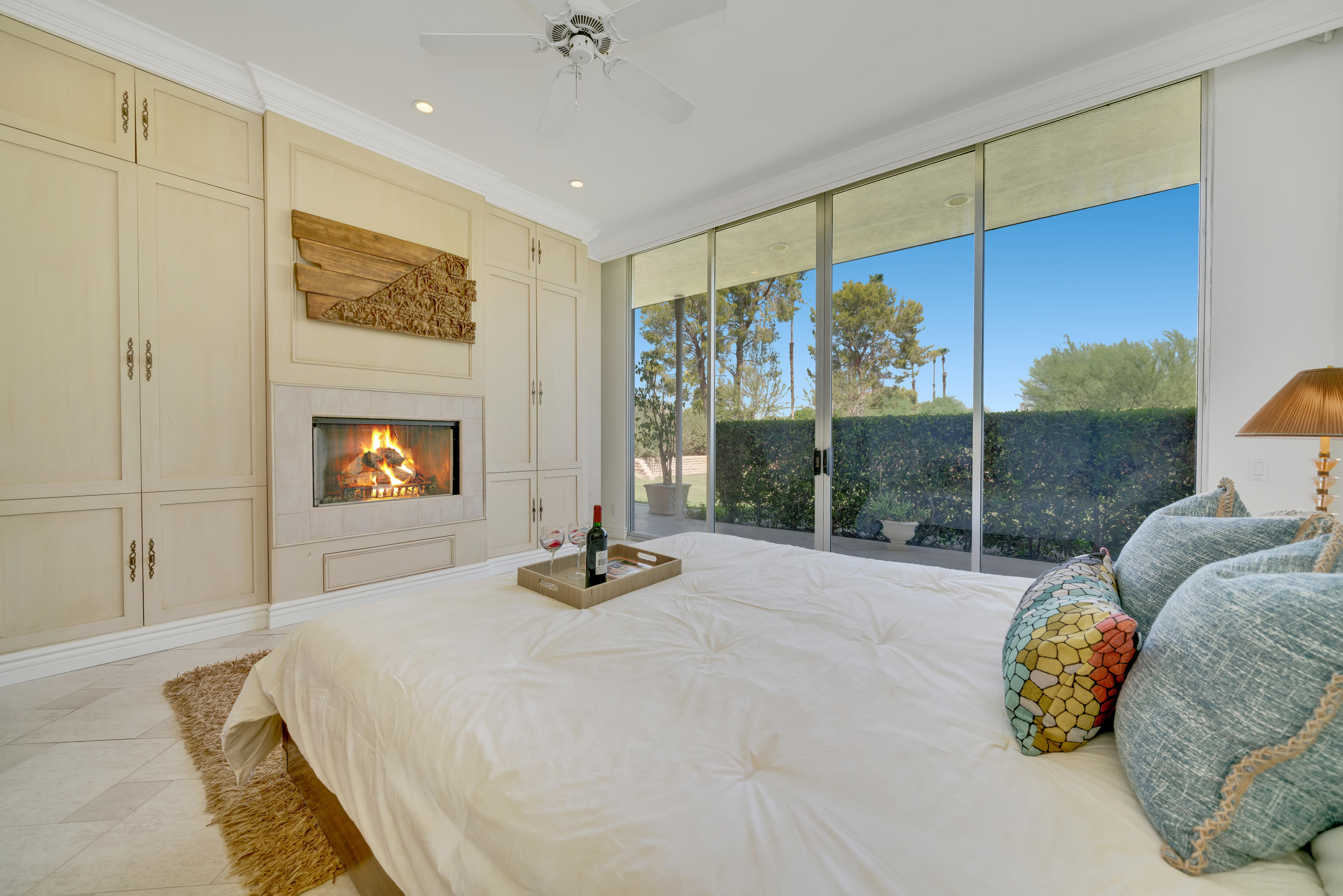 47420 Rabat Drive Palm Desert, CA 92260 - Photo 31 of 50 a bed room with a bed and a fireplace