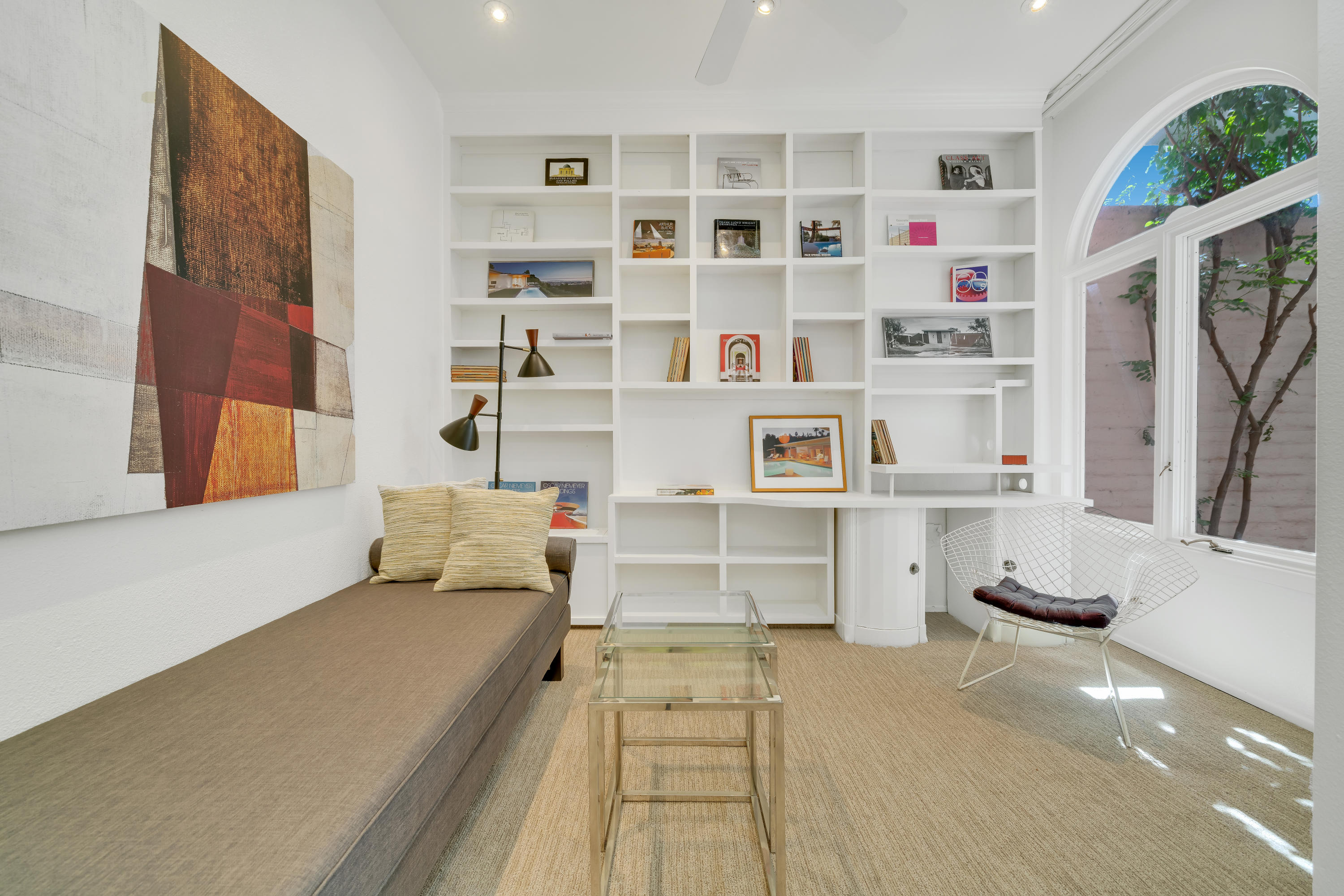 47420 Rabat Drive Palm Desert, CA 92260 - Photo 33 of 50 a living room with furniture and a book shelf