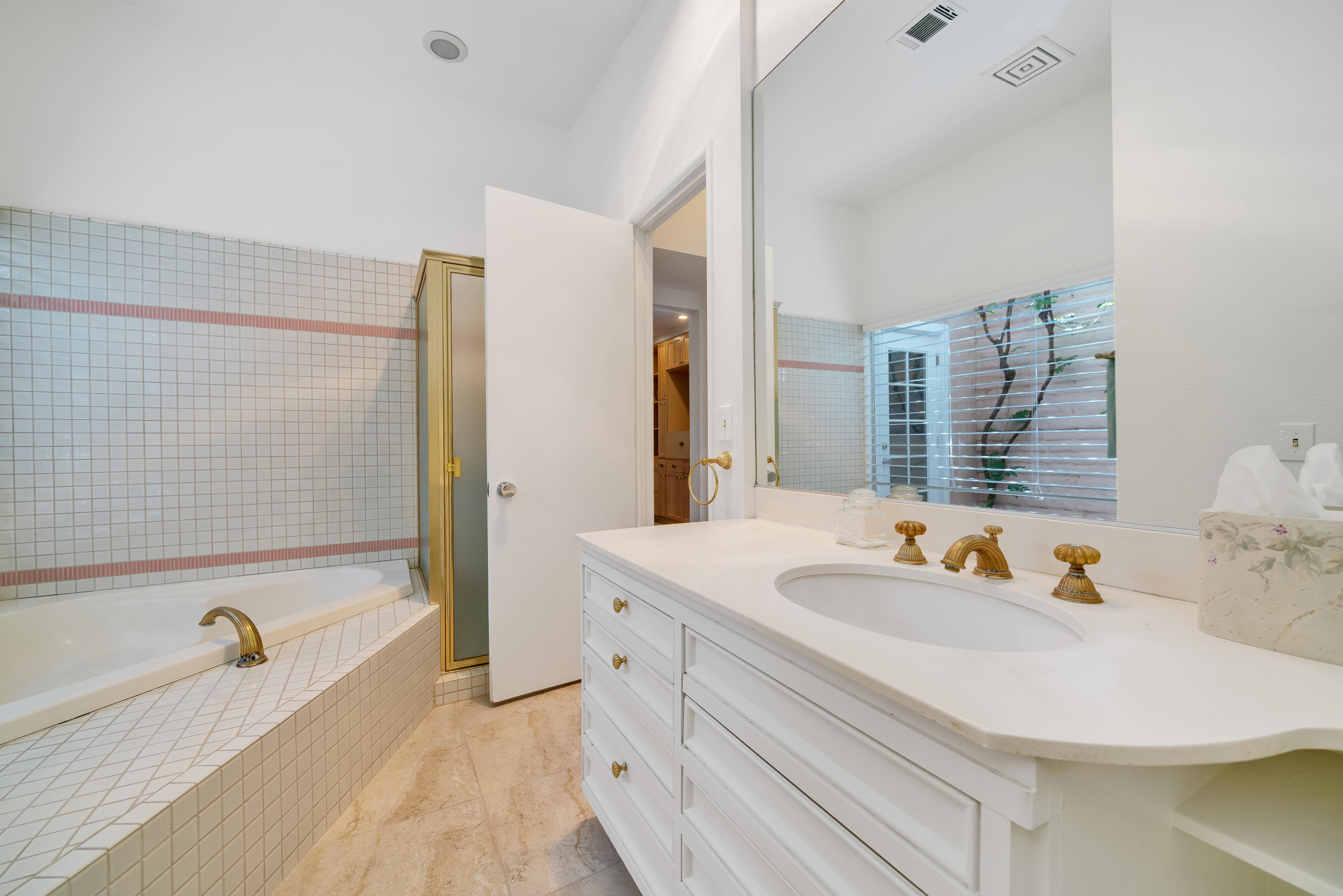 47420 Rabat Drive Palm Desert, CA 92260 - Photo 35 of 50 a bathroom with a sink and a bathtub