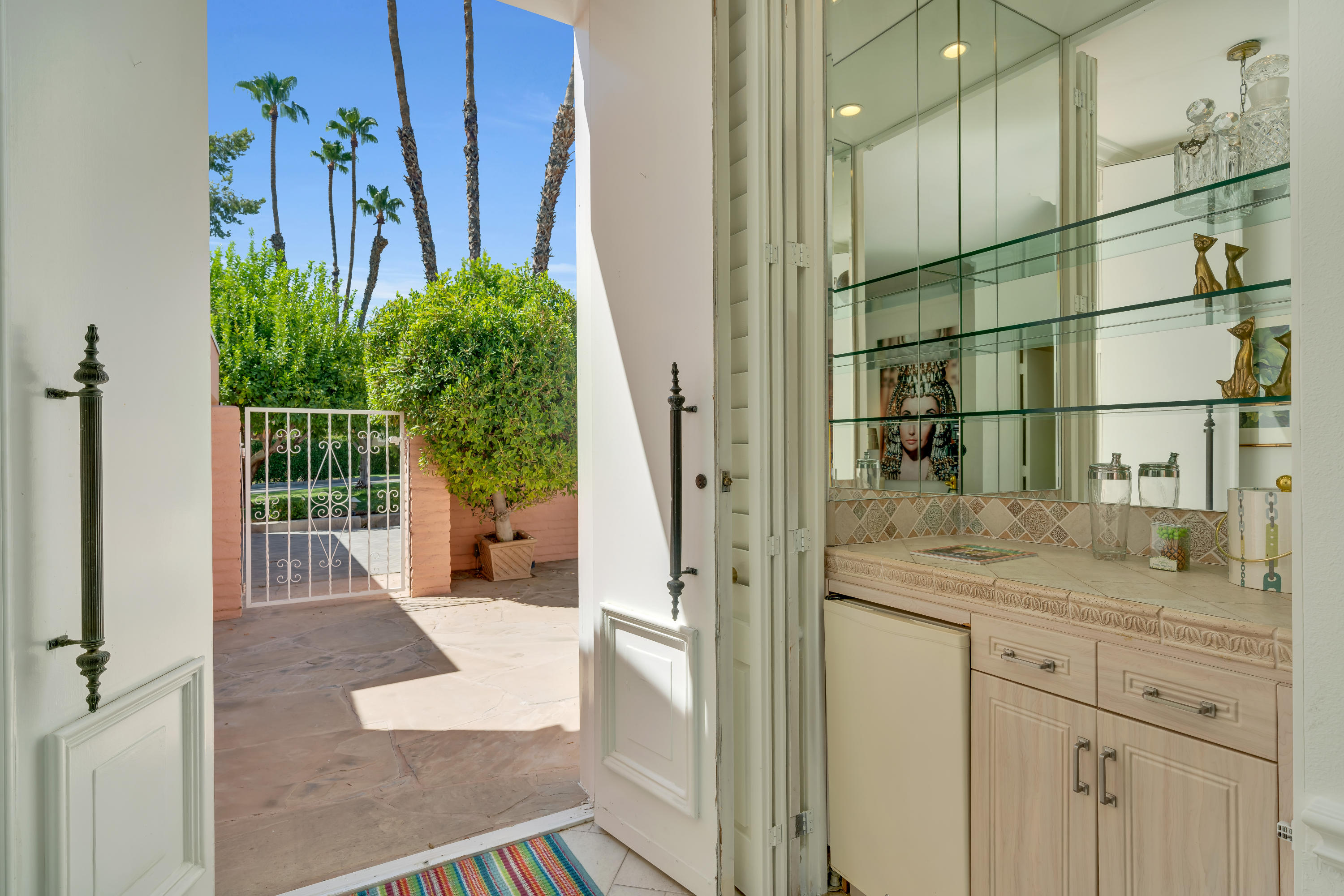 47420 Rabat Drive Palm Desert, CA 92260 - Photo 6 of 50 a bathroom with a granite countertop sink a mirror and shower