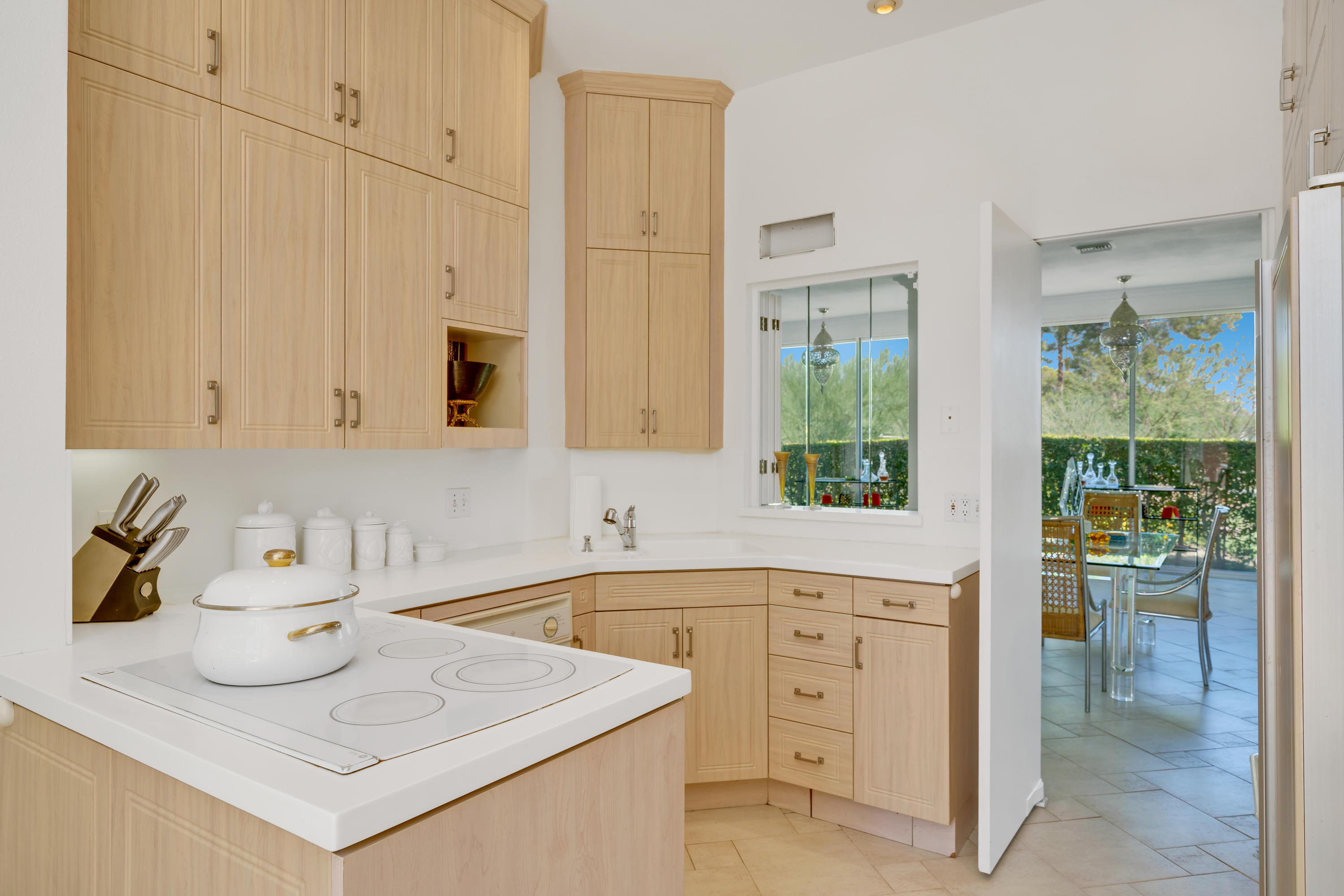 47420 Rabat Drive Palm Desert, CA 92260 - Photo 10 of 50 a kitchen with appliances cabinets and a sink