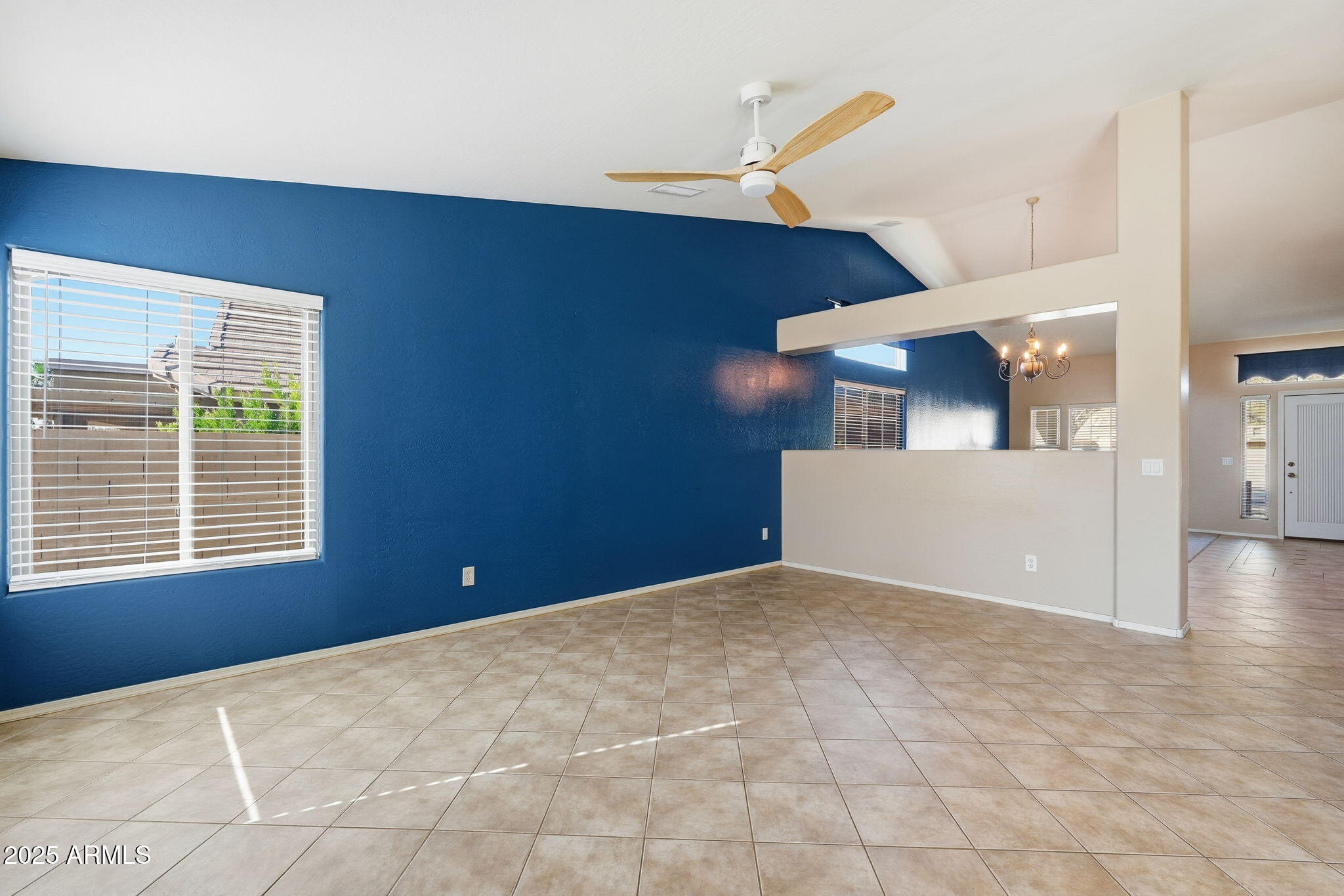 17509 West Rock Ledge Road Goodyear, AZ 85338 - Photo 10 of 55 a view of a room with a ceiling fan and window