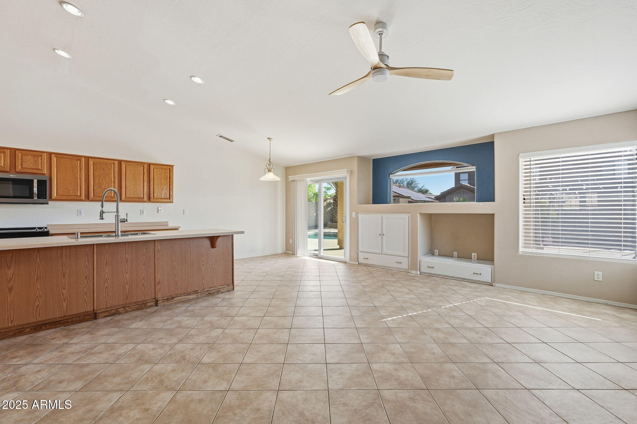 17509 West Rock Ledge Road Goodyear, AZ 85338 - Photo 11 of 55 a view of a kitchen with a sink and a window