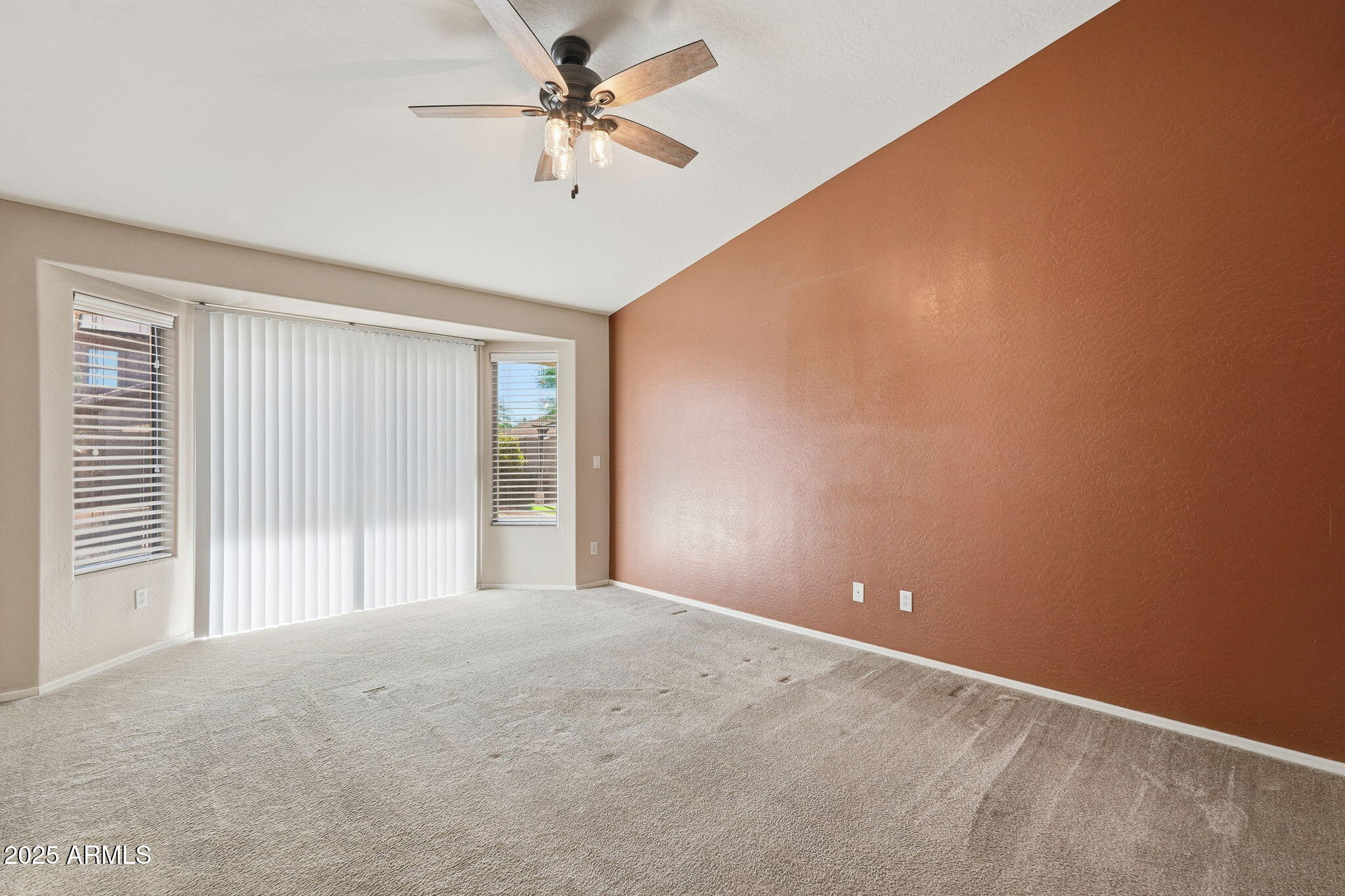 17509 West Rock Ledge Road Goodyear, AZ 85338 - Photo 27 of 55 a view of a big room with windows and ceiling fan