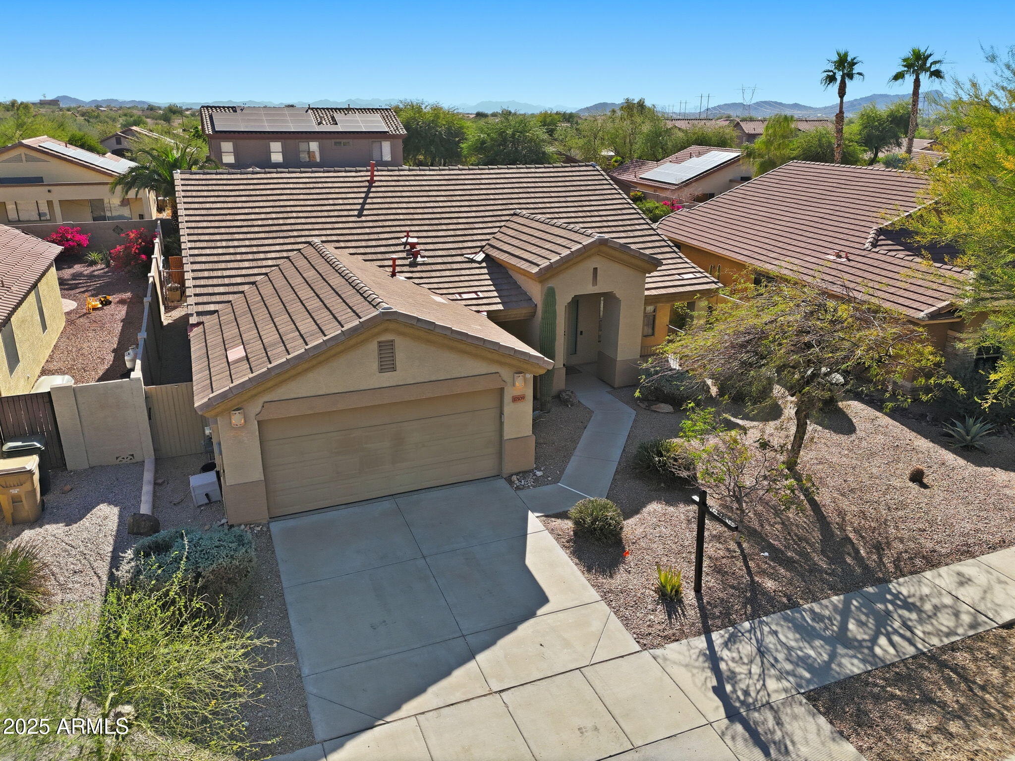 17509 West Rock Ledge Road Goodyear, AZ 85338 - Photo 2 of 55 an aerial view of a house with a yard