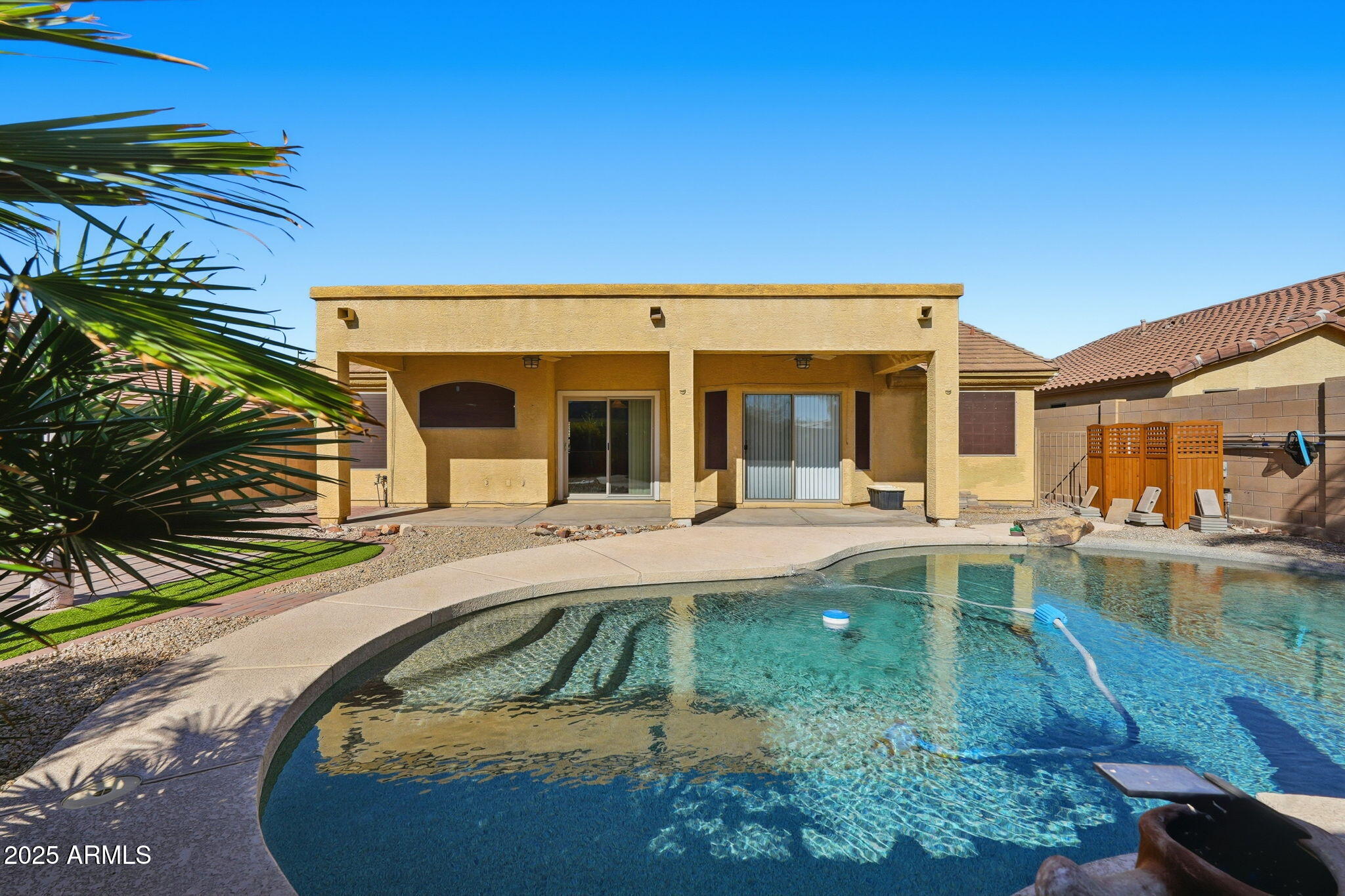 17509 West Rock Ledge Road Goodyear, AZ 85338 - Photo 40 of 55 a view of a house with swimming pool and porch