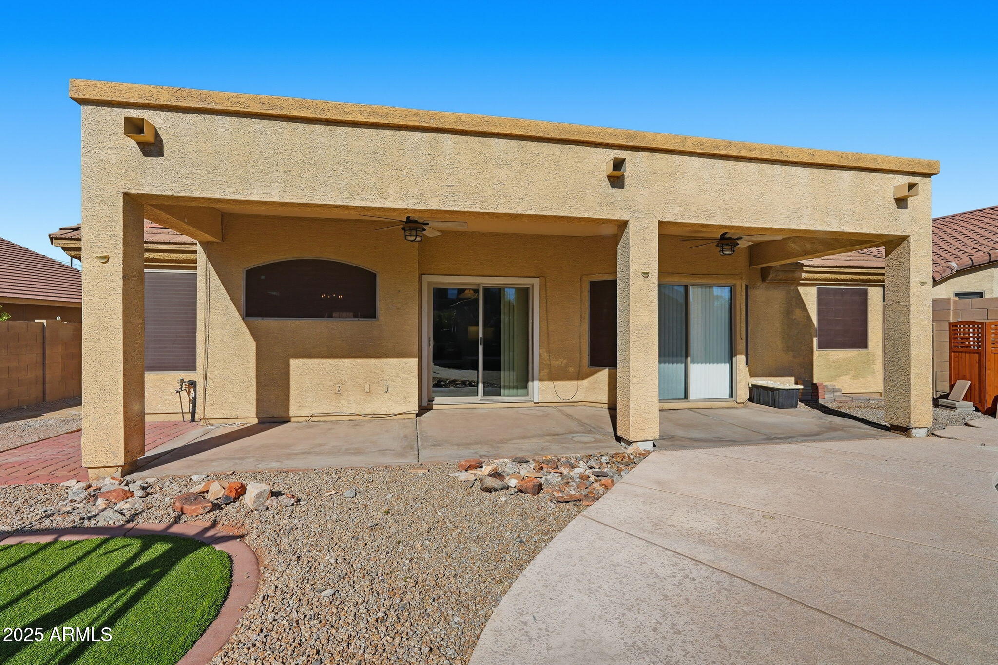 17509 West Rock Ledge Road Goodyear, AZ 85338 - Photo 41 of 55 a front view of a house with a outdoor space
