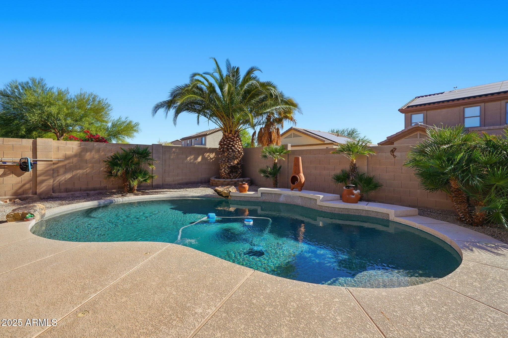 17509 West Rock Ledge Road Goodyear, AZ 85338 - Photo 45 of 55 a view of a swimming pool with a yard