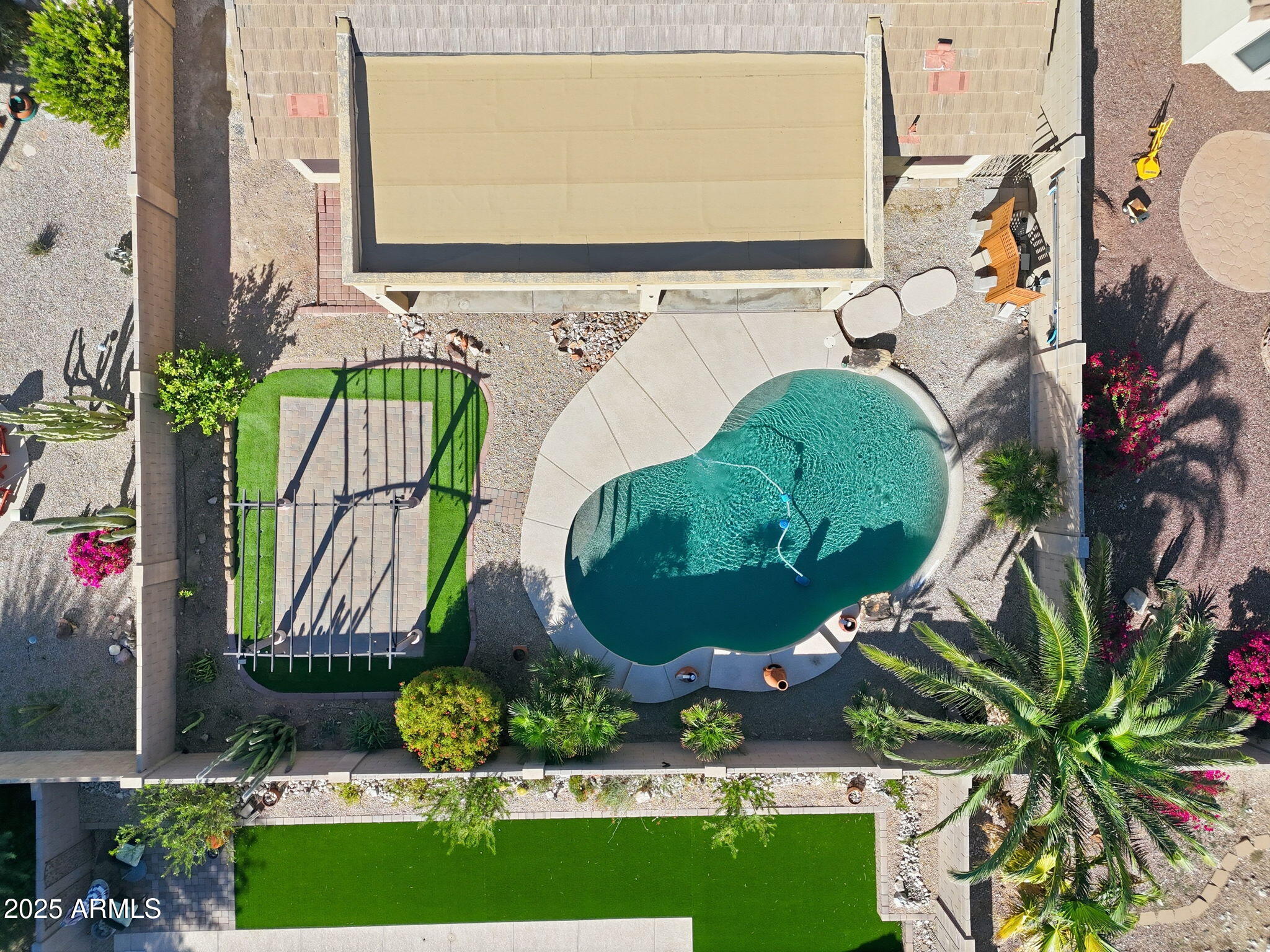 17509 West Rock Ledge Road Goodyear, AZ 85338 - Photo 47 of 55 a view of a fountain in front of house