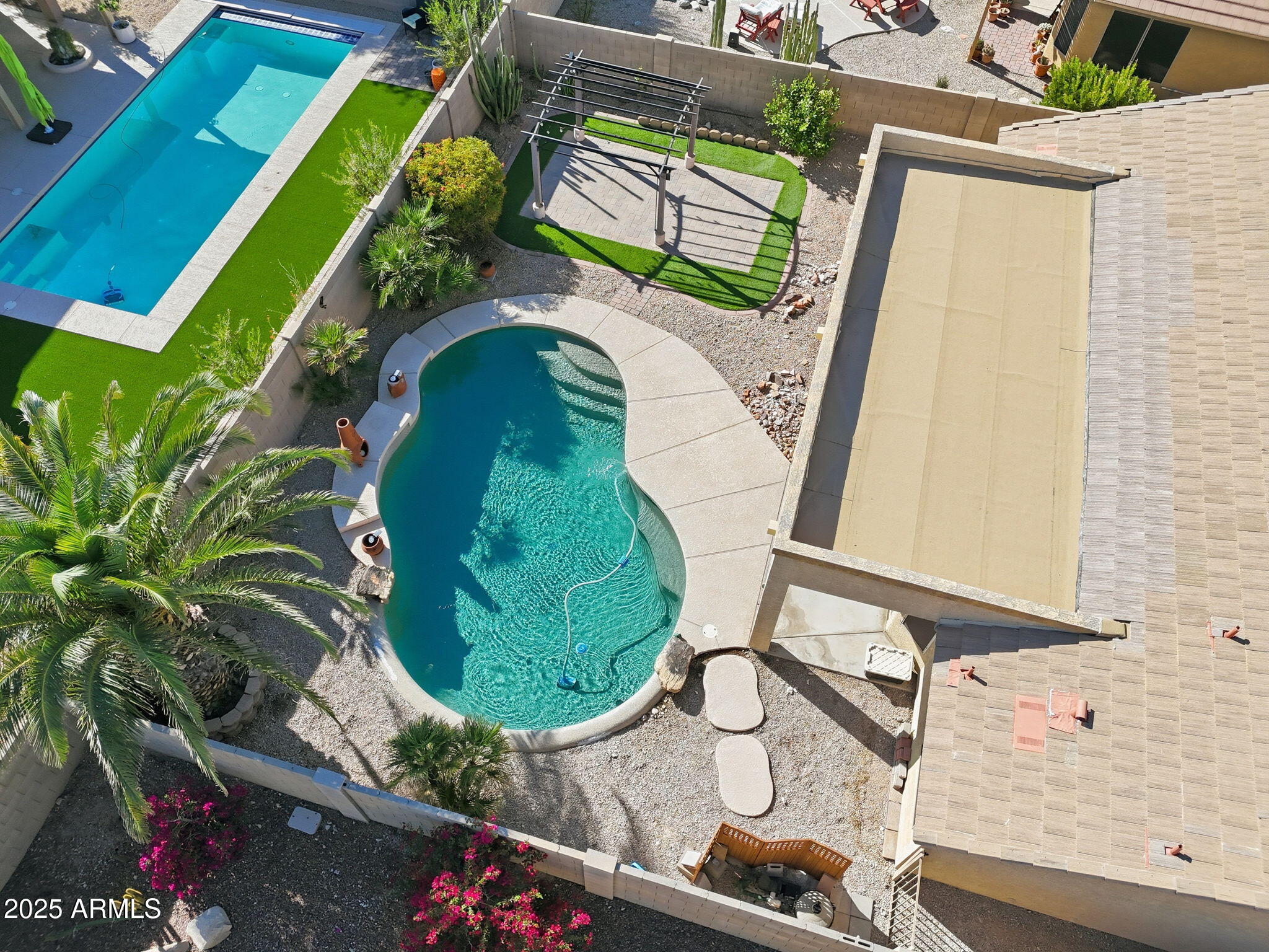 17509 West Rock Ledge Road Goodyear, AZ 85338 - Photo 48 of 55 a view of swimming pool with a backyard