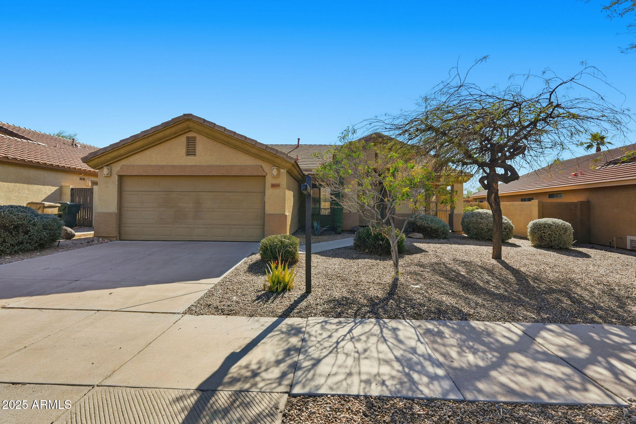 17509 West Rock Ledge Road Goodyear, AZ 85338 - Photo 53 of 55 a front view of a house with a yard
