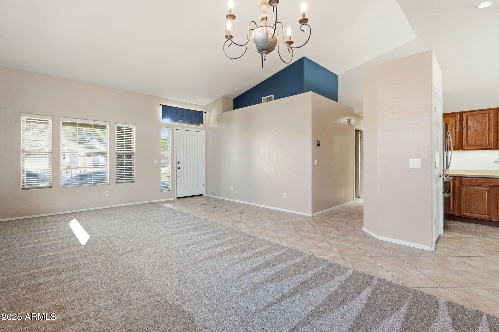 17509 West Rock Ledge Road Goodyear, AZ 85338 - Photo 6 of 55 a view of an empty room with window and cabinet