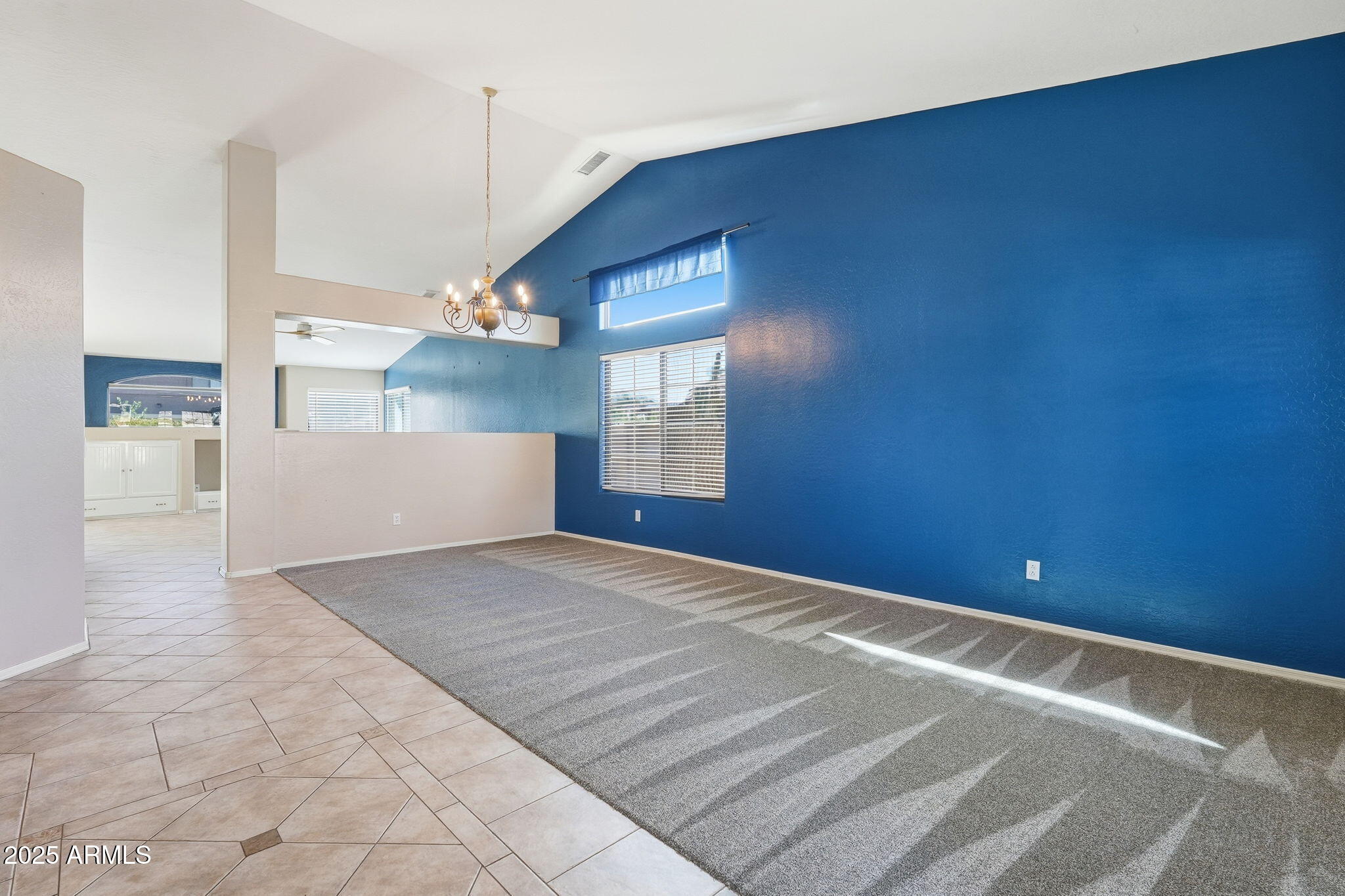 17509 West Rock Ledge Road Goodyear, AZ 85338 - Photo 7 of 55 a view of empty room with wooden floor and fan