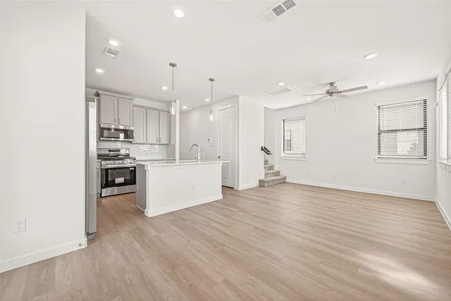 a view of kitchen with wooden floor