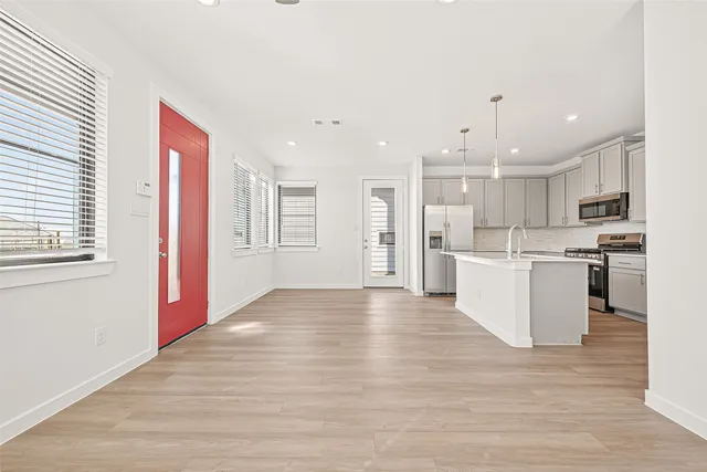 a view of kitchen with wooden floor