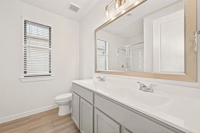 a bathroom with a sink and a large mirror