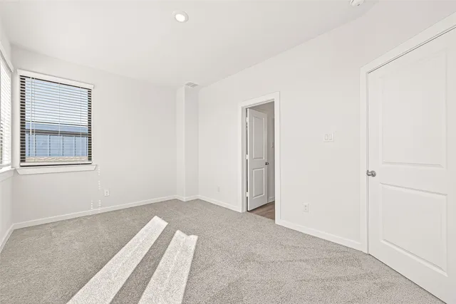 a view of a room with closet and wooden floor