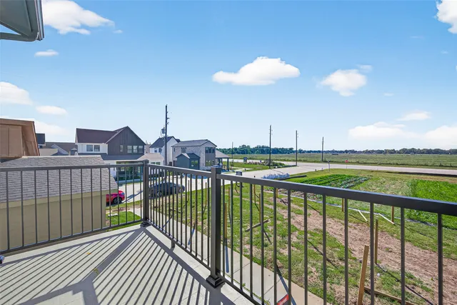a view of a balcony with wooden floor