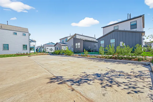 a view of a park with a large tree