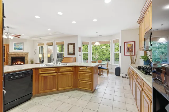 a large kitchen with a table and chairs