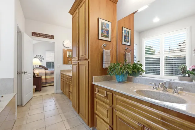 a bath tub sitting in a bathroom next to a window