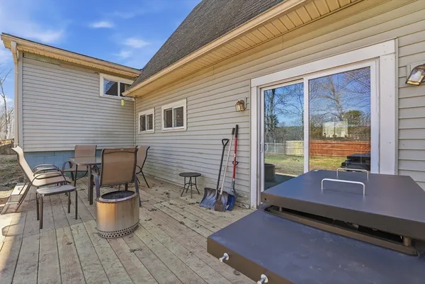 a view of a patio with chairs and a table