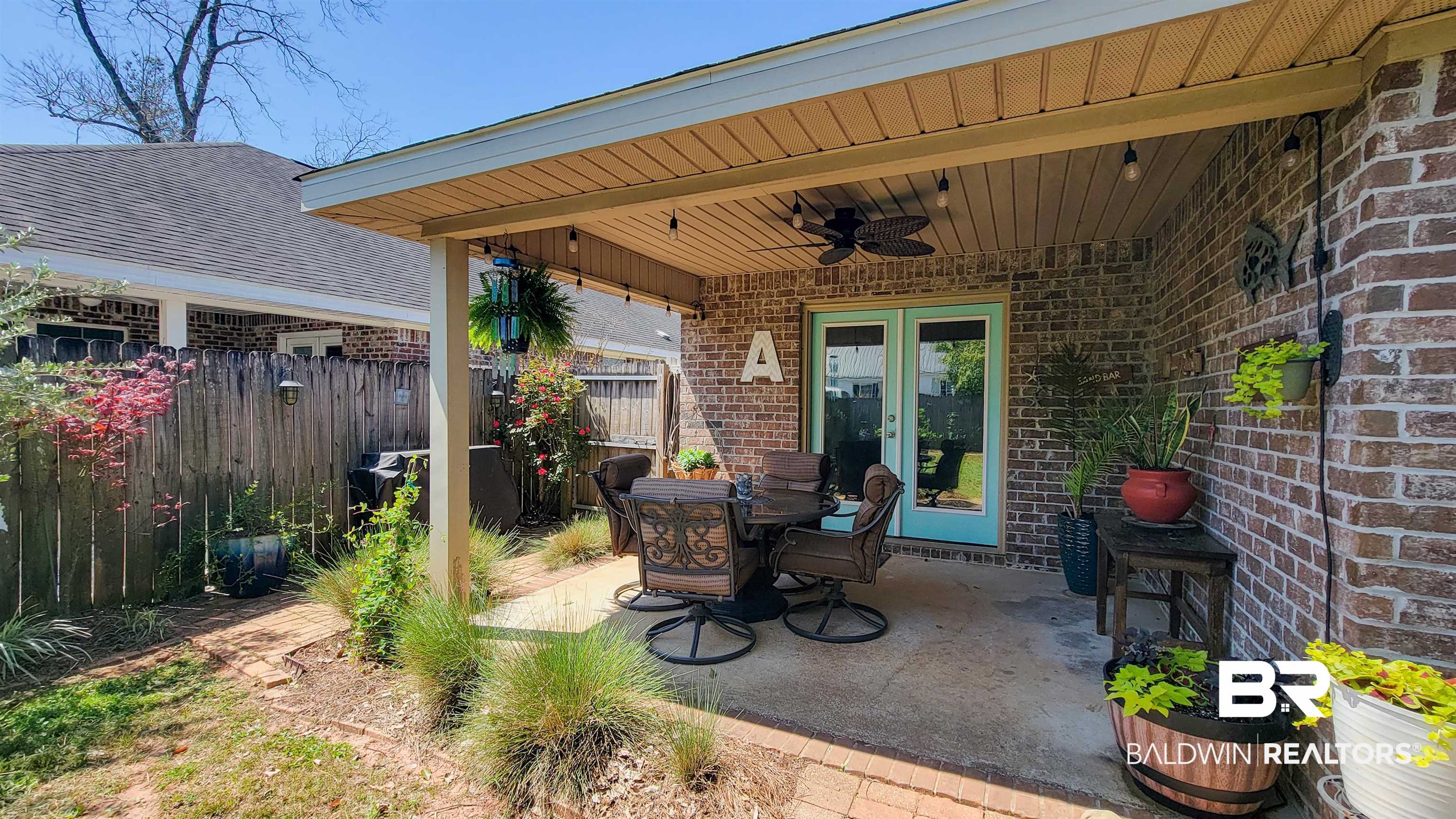1304 Majesty Loop Foley, AL 36535 - Photo 26 of 44 View of patio / terrace with a ceiling fan, outdoor dining area, and french doors