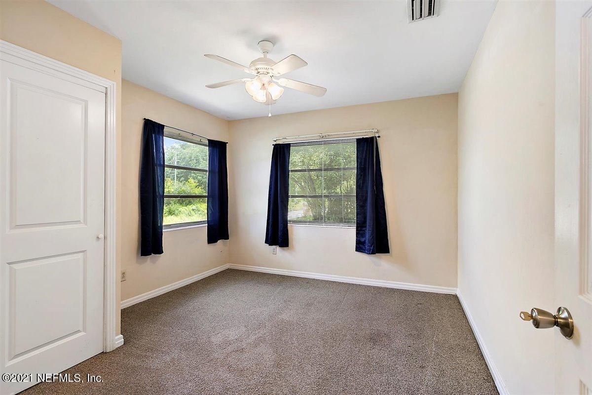 1951 Huntsford Road Jacksonville, FL 32207 - Photo 11 of 17 an empty room with windows and closet