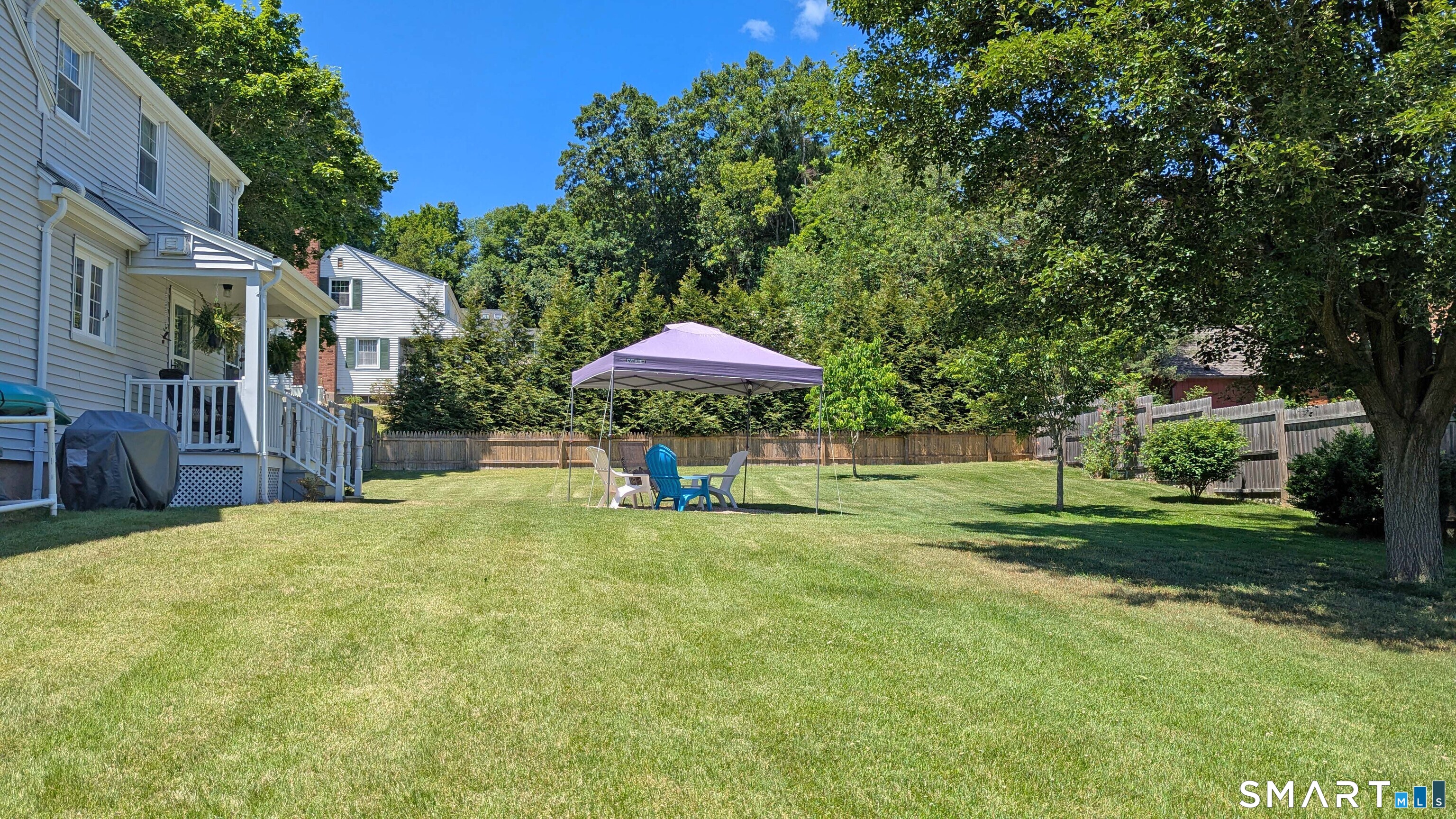 65 Prout Hill Road Middletown, CT 06457 - Photo 26 of 31 The backyard is entirely enclosed by a wood privacy fence