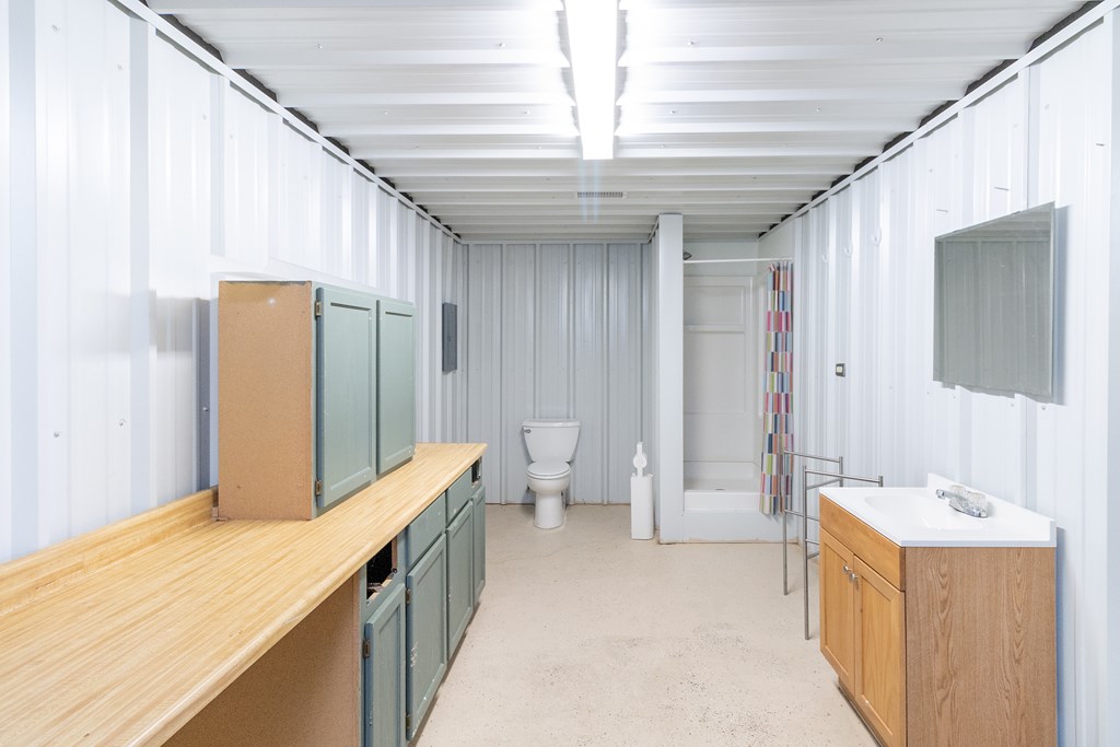 2280 County Road 4606 Paint Rock, TX 76866 - Photo 2 of 55 a spacious bathroom with a double vanity sink a toilet and a shower