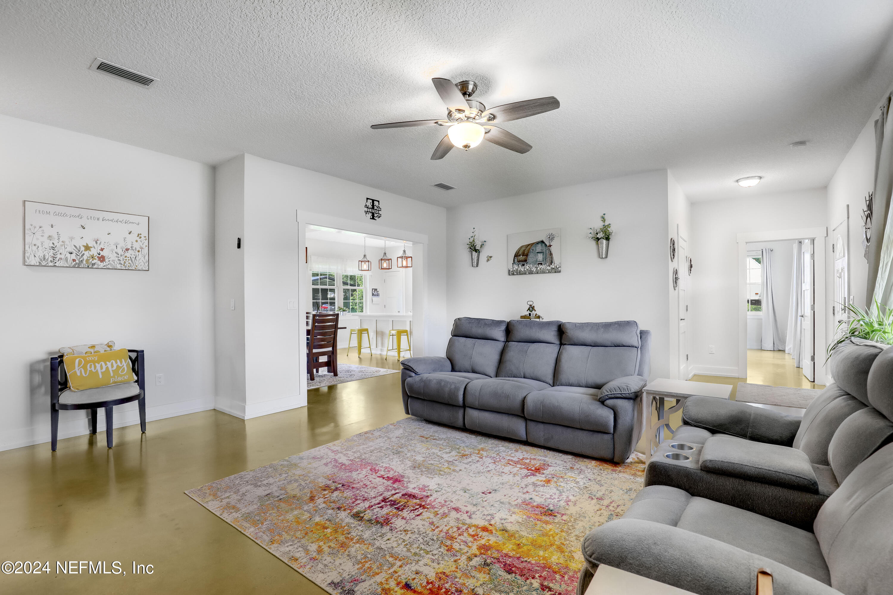 540685 Lem Turner Road Callahan, FL 32011 - Photo 13 of 58 a living room with furniture and a rug