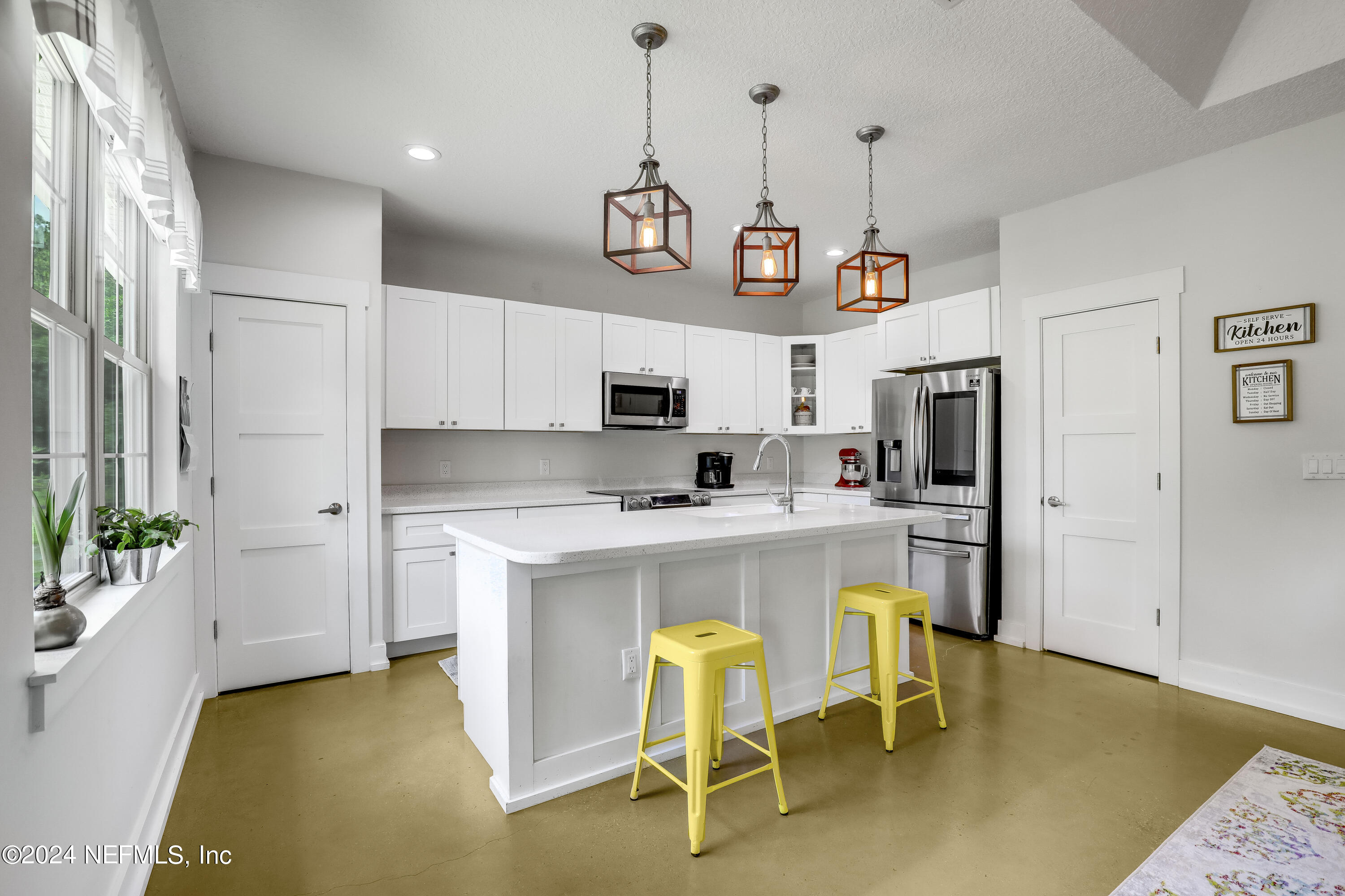540685 Lem Turner Road Callahan, FL 32011 - Photo 2 of 58 a large kitchen with a table and chairs
